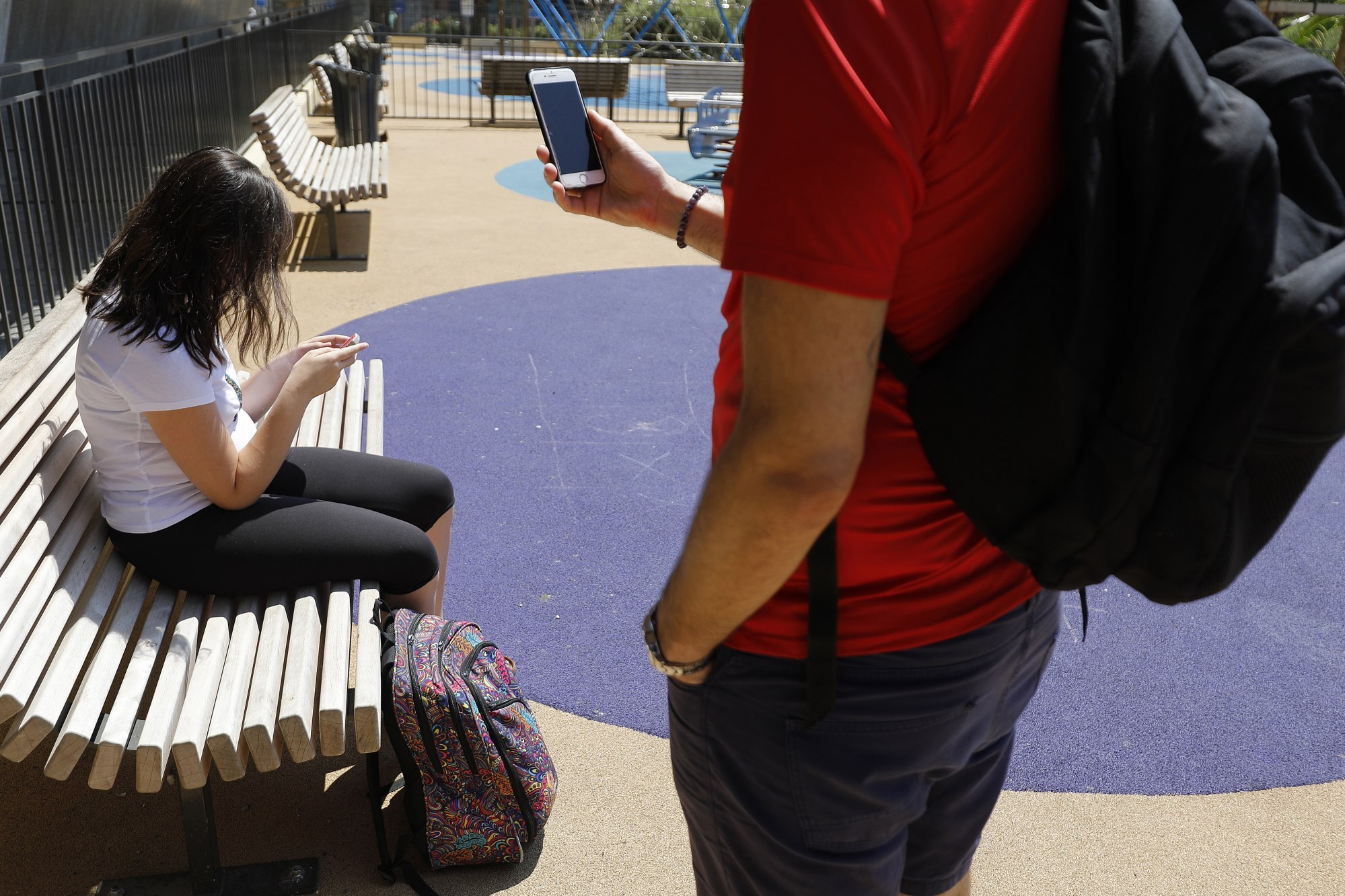 Young people use their mobile phones in Nice, southern France, in July 2018. The French Parliament has voted to ban mobile phones and related devices in schools and colleges. Photo: EPA-EFE
