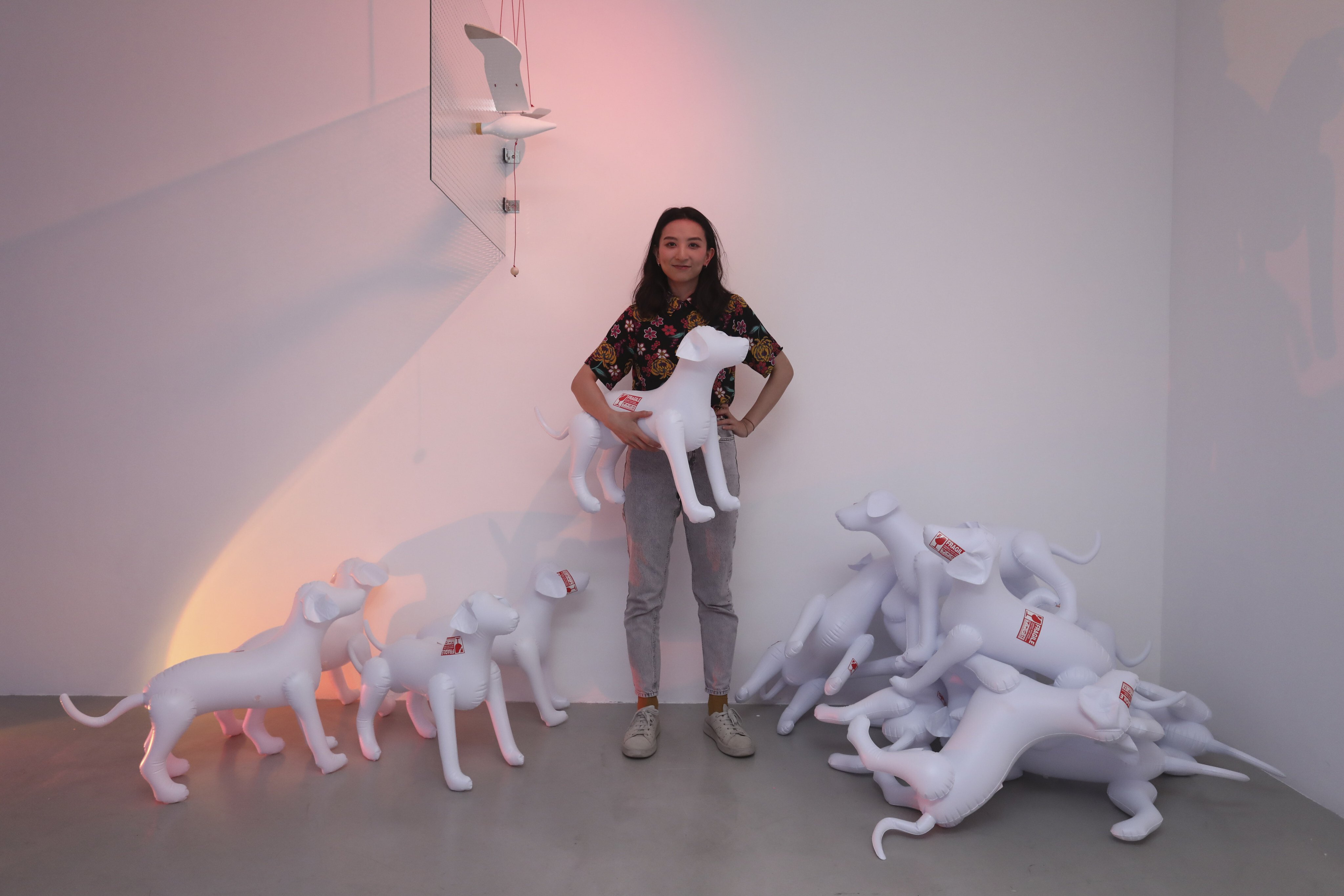 Artist Chan Ka-kiu pictured with her work I Wanna be Your Dog, part of the “Ze/Ro” exhibition at Ben Brown Fine Arts in Wong Chuk Hang. Photo: Jonathan Wong