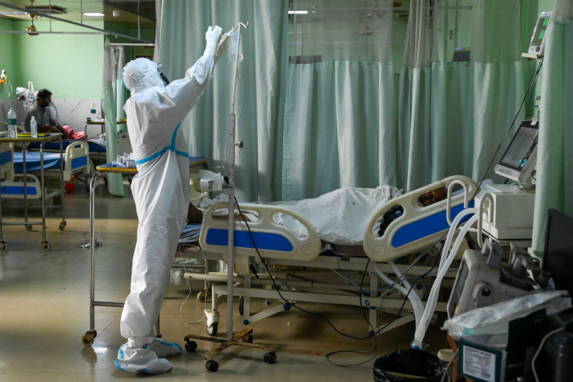 A health worker attends to a Covid-19 patient in Moradabad. Photo: AFP