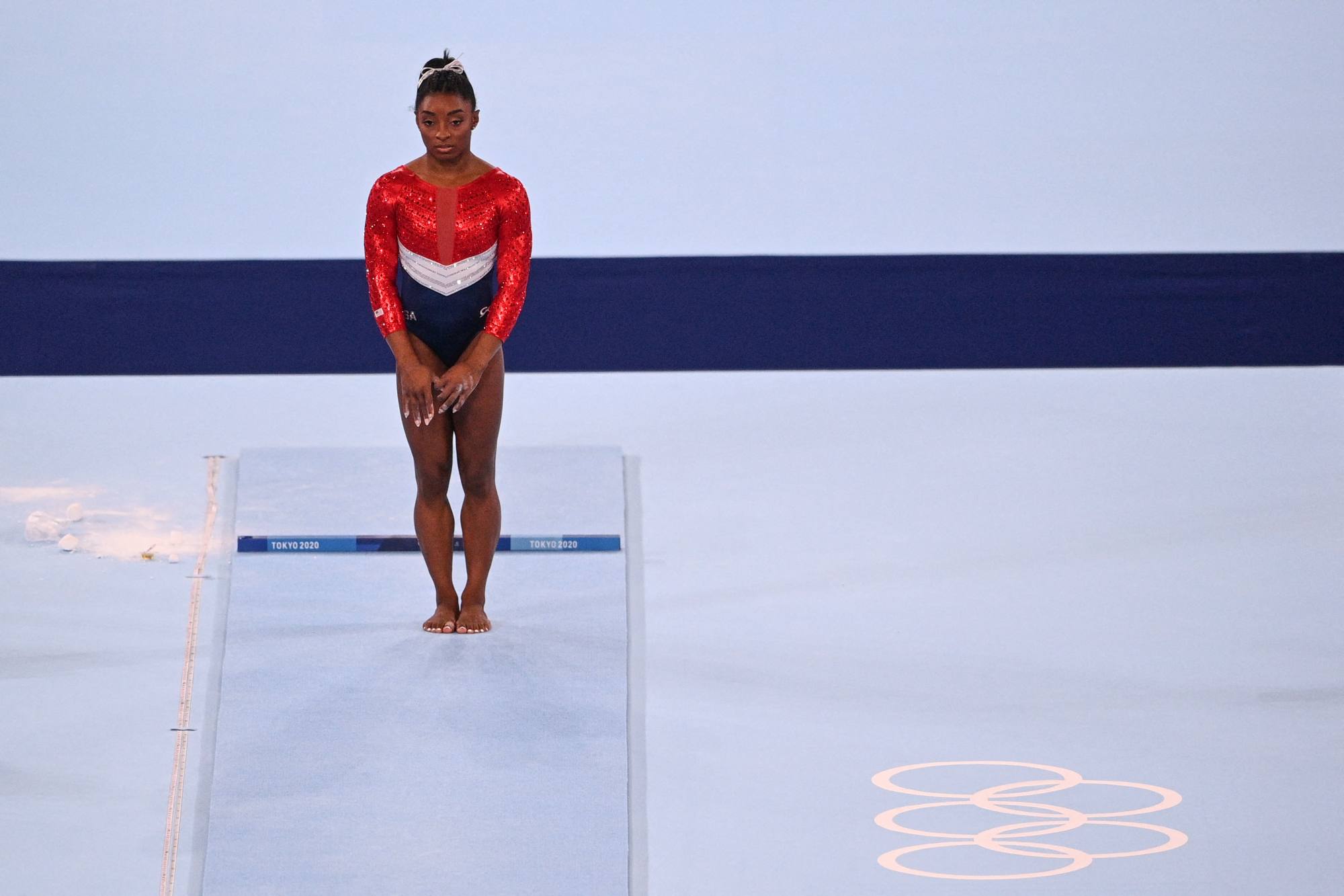 Simone Biles waits before competing in the vault event of the artistic gymnastics women’s team final during the Tokyo 2020 Olympic Games at the Ariake Gymnastics Centre in Tokyo, Japan, on July 28. Photo: AFP
