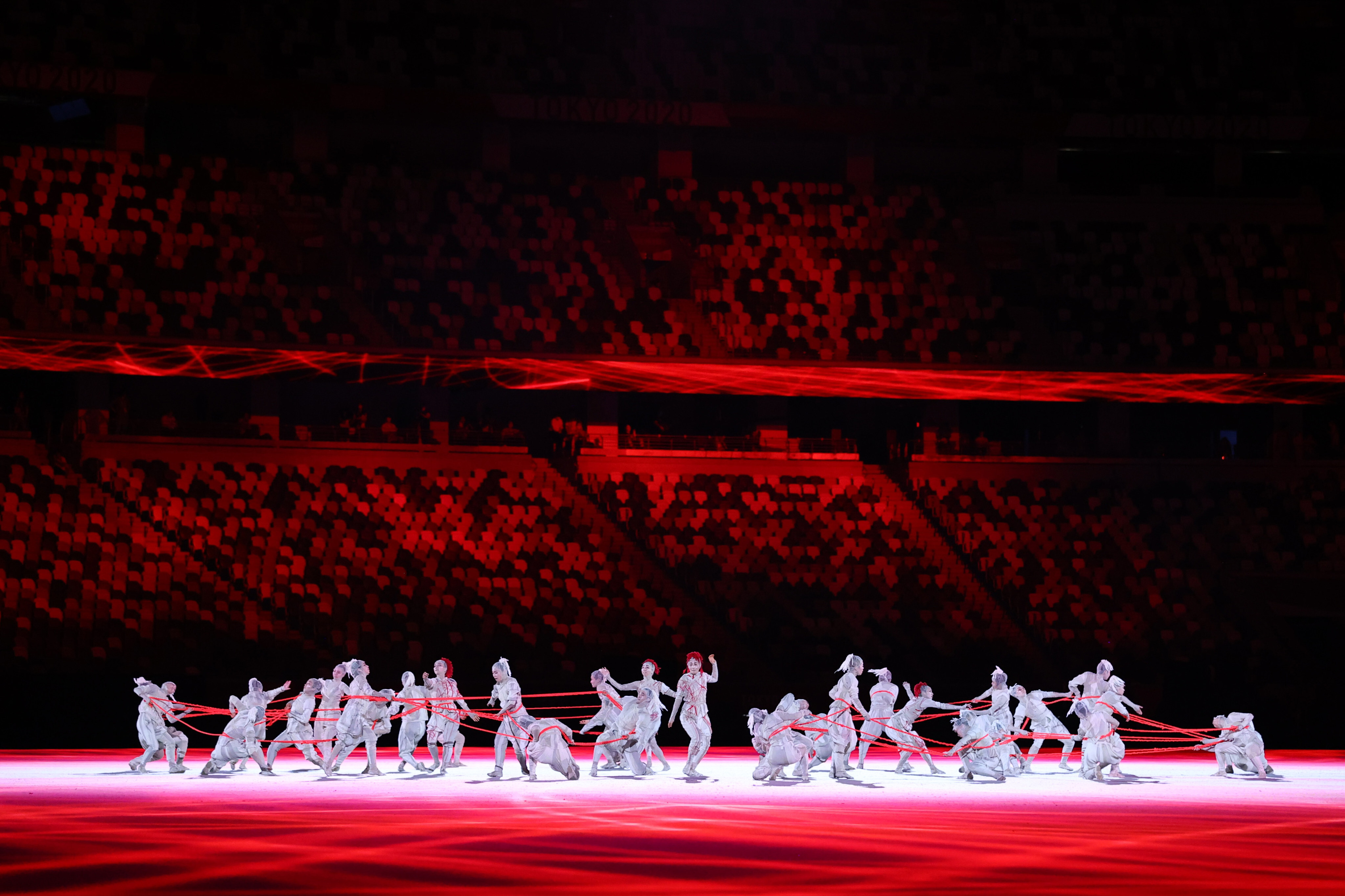 Performers put on a show before empty stands at the Tokyo 2020 Olympics opening ceremony on July 23. Photo: Reuters