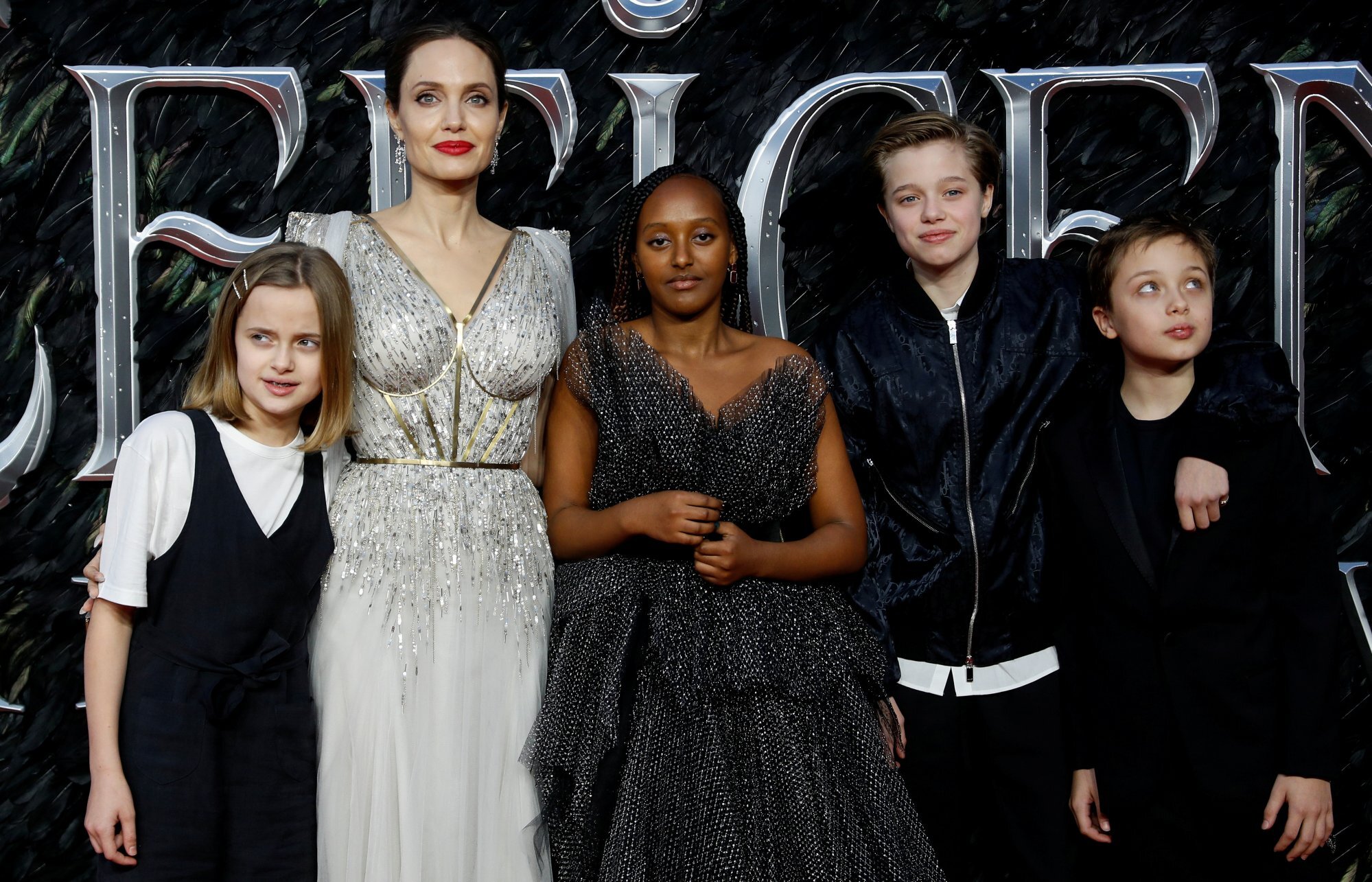 Angelina Jolie, accompanied by her children, poses as she attends the UK premiere of Maleficent: Mistress of Evil in London, Britain, in October 2019. Photo: Reuters
