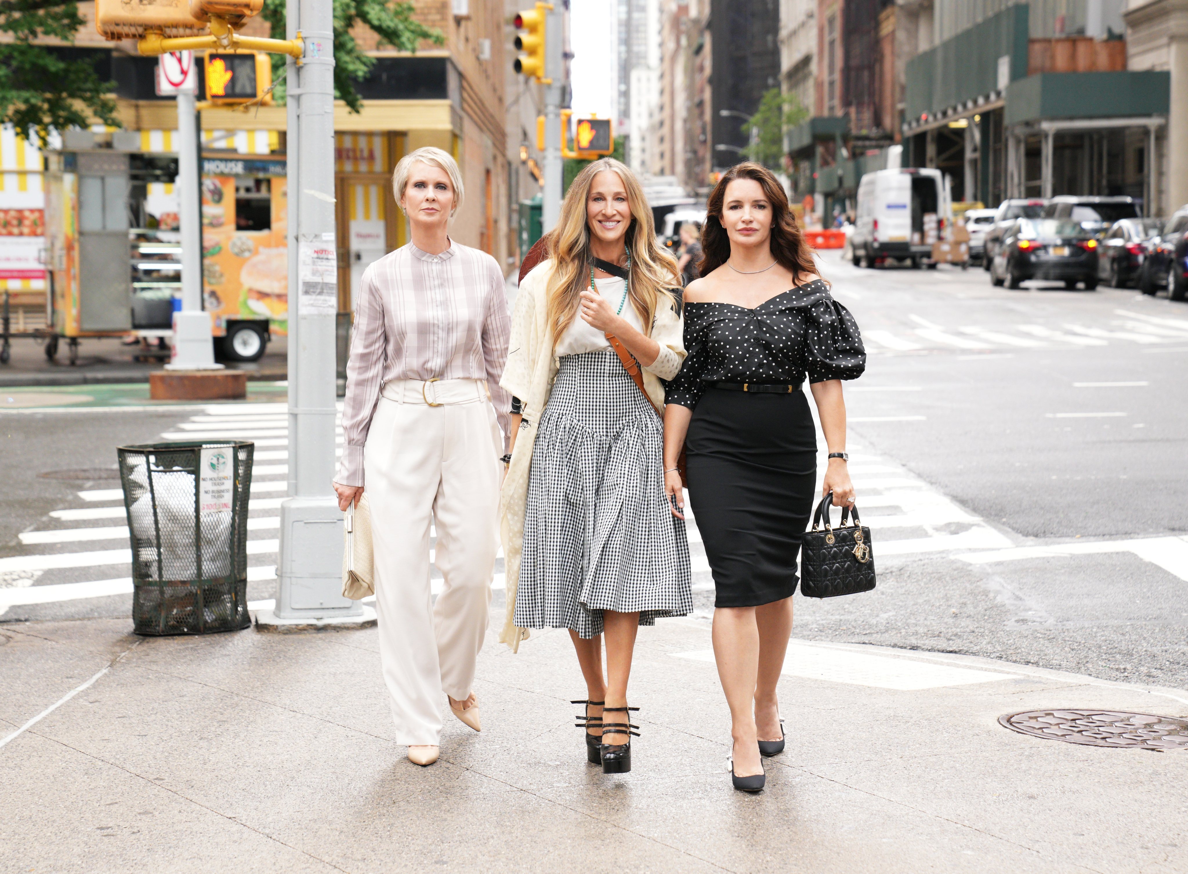 From left, Cynthia Nixon, Sarah Jessica Parker and Kristin Davis as Miranda, Carrie and Charlotte: three of the lead characters from Sex and the City return in 2021’s sequel series on HBO Max, And Just Like That, continuing to flaunt a designer wardrobe. Photo: HBO GO