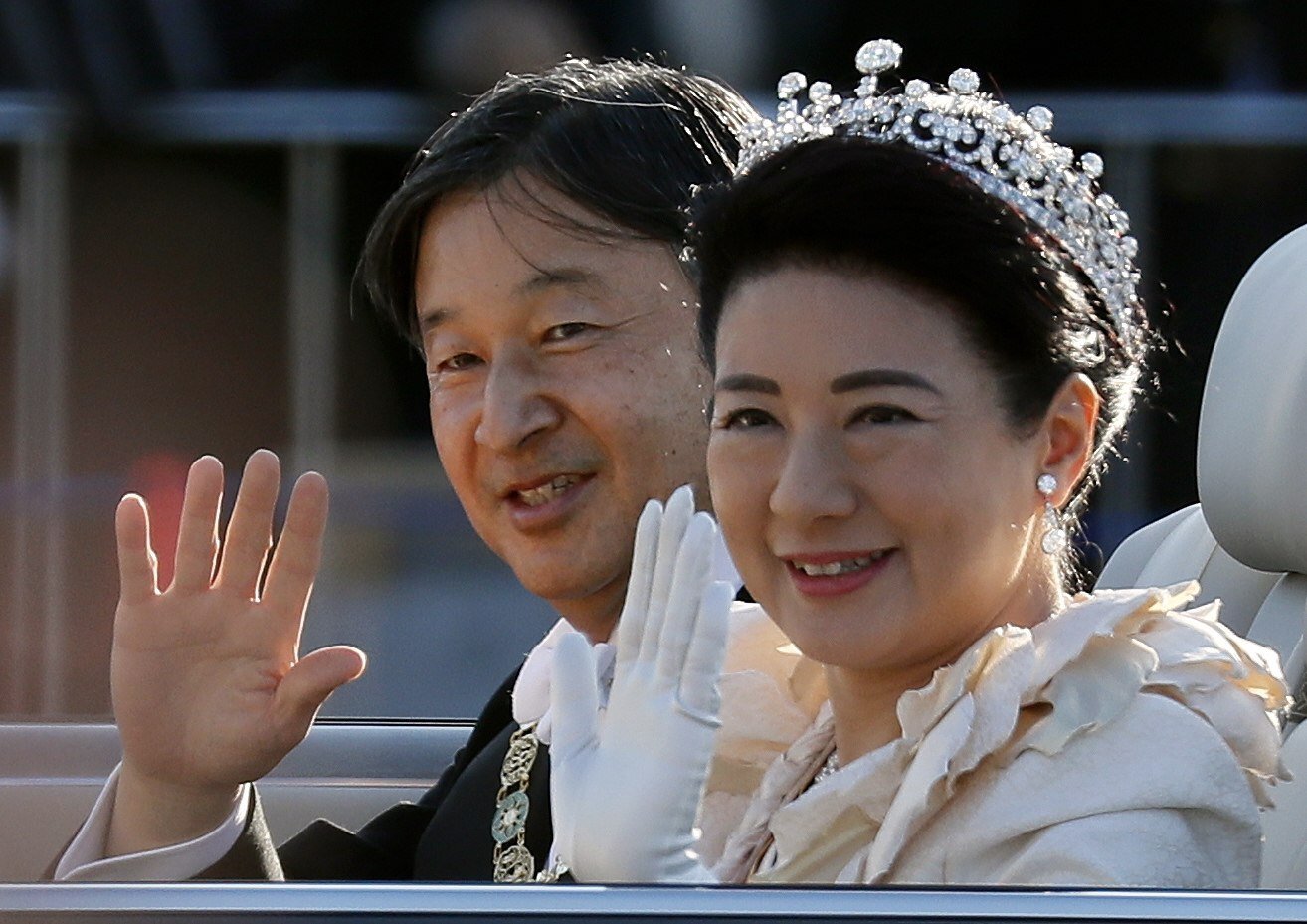 Japan’s Empress Masako and husband Emperor Naruhito wave to well-wishers after his official accession to the Chrysanthemum throne in late 2019, but her usual look is more understated and dominated by pearls. Photo: EPA-EFE