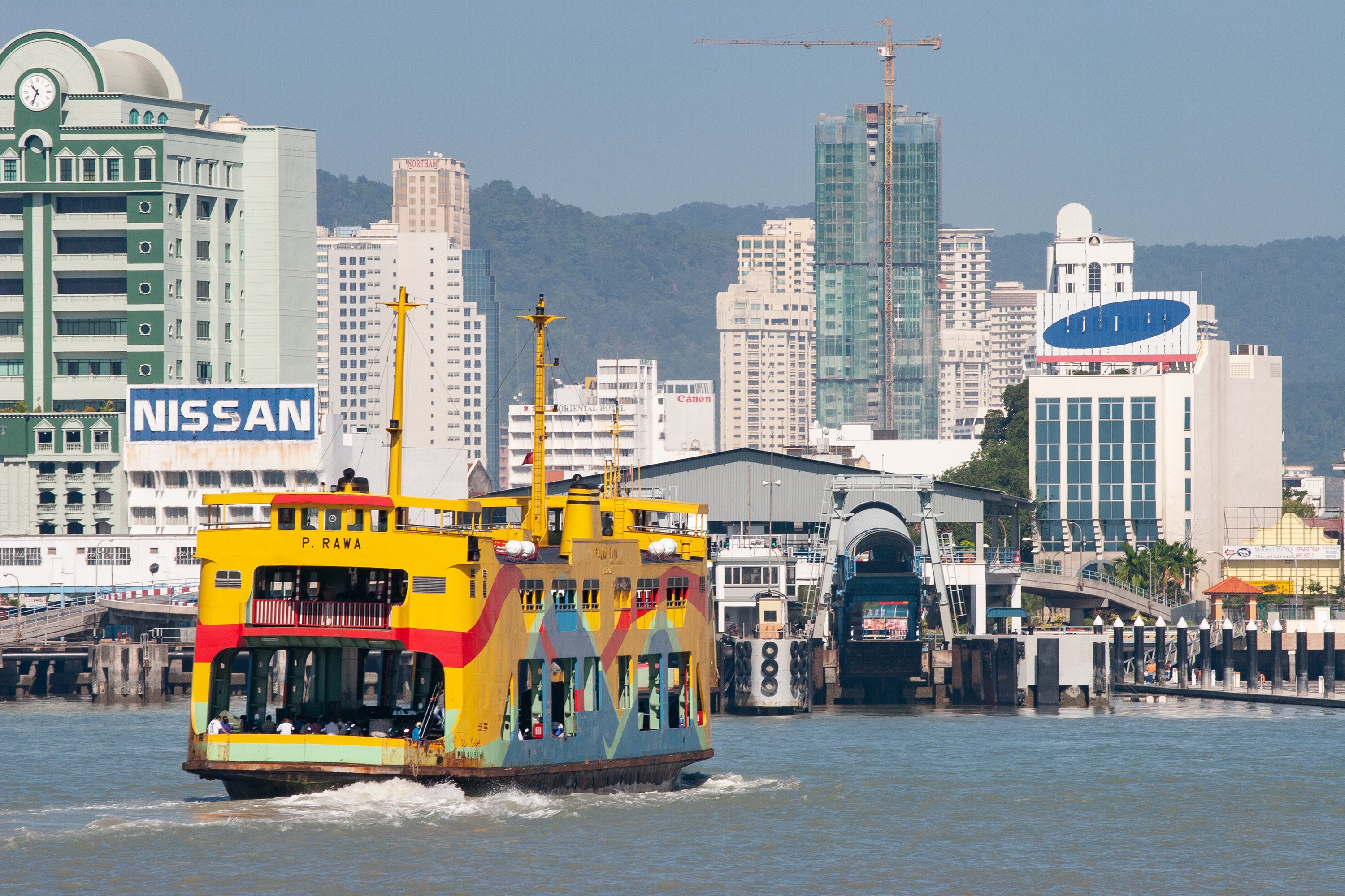 A double-decker ferry like those being preserved nears shore in Penang, Malaysia, in 2006. Ferries have sailed between the island and the mainland since the 1890s. Photo: Thum Chia Chieh