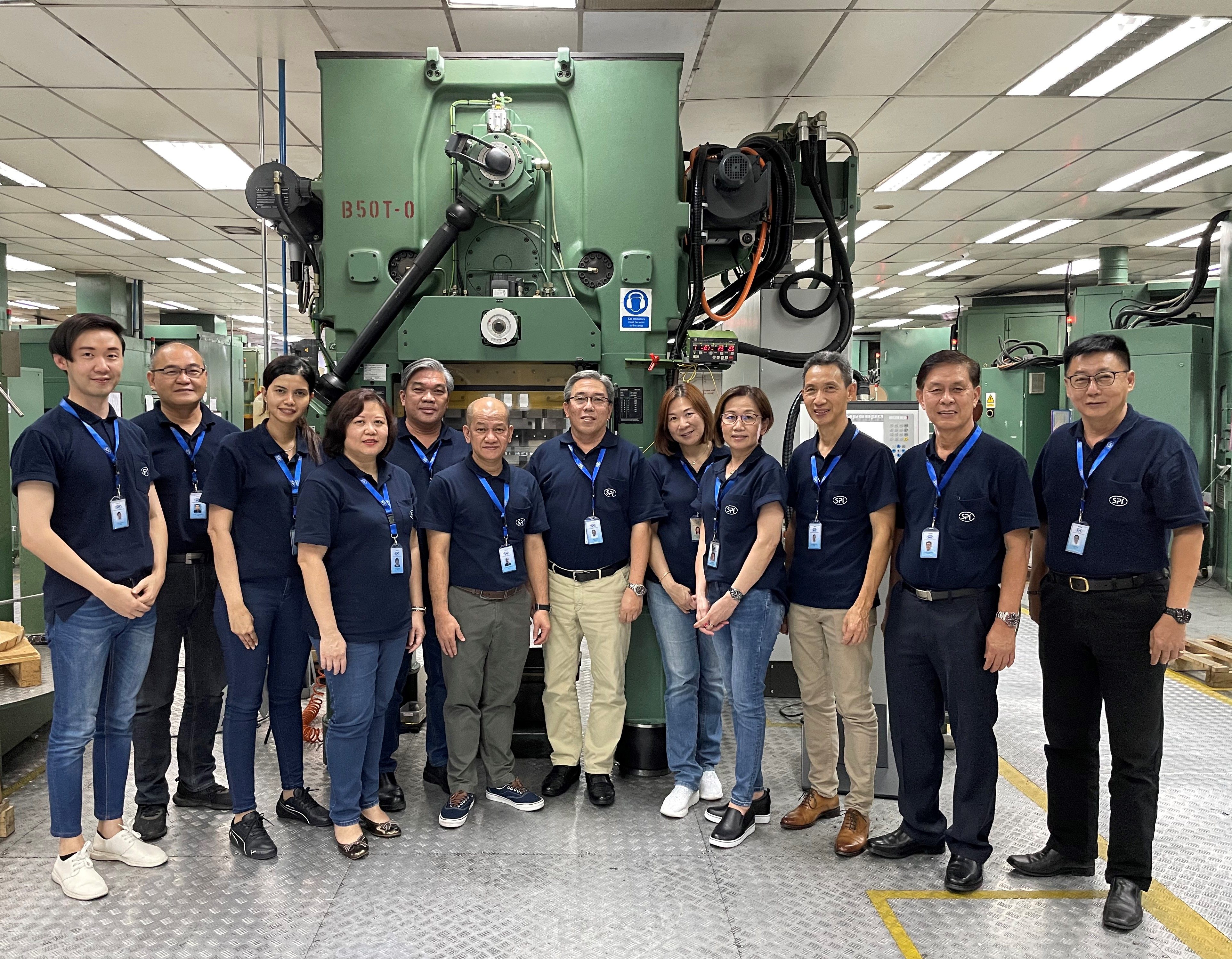 Swiss Precision Industries Group managing director Adrian Lim (center) with his management team