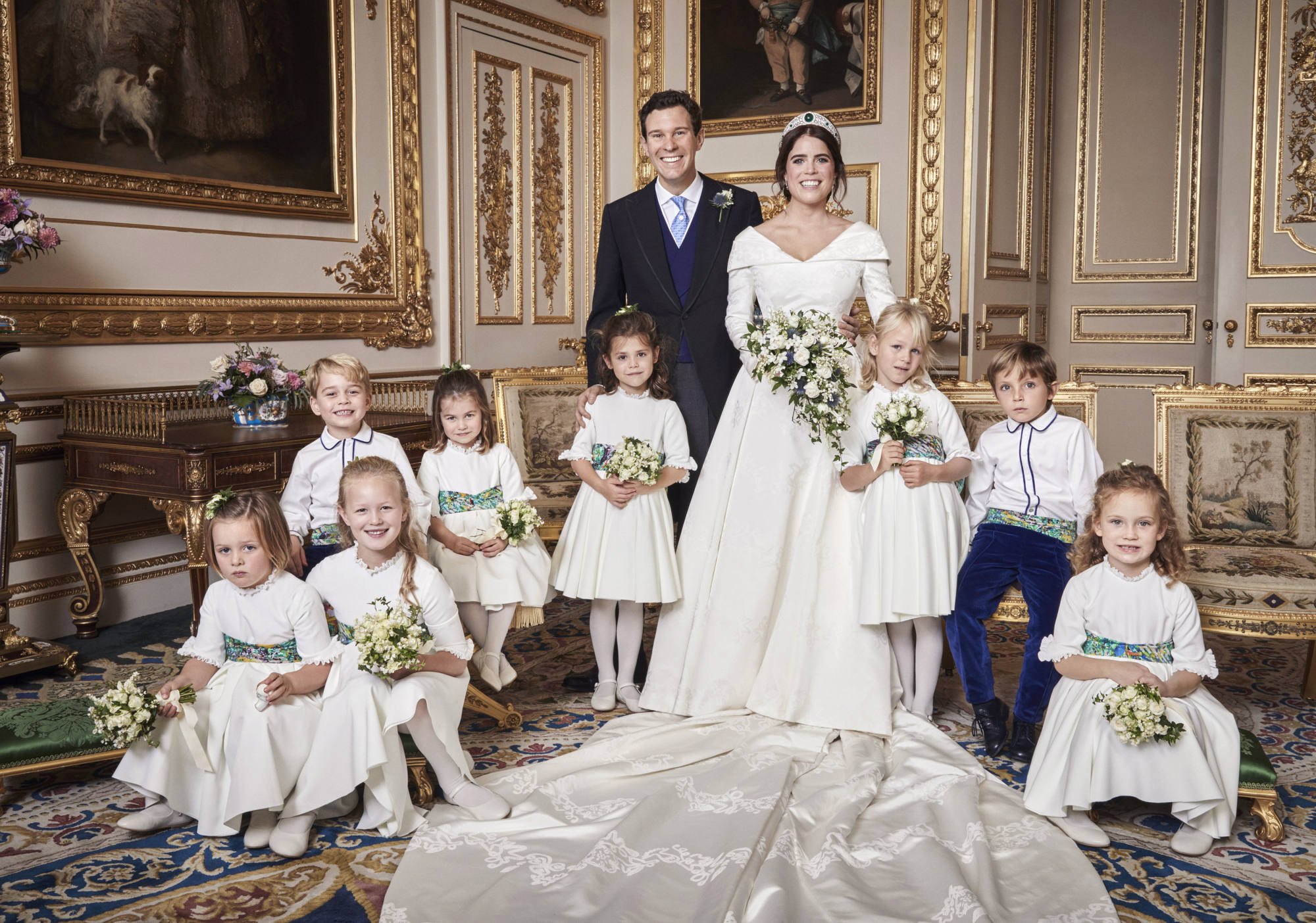 Britain’s Princess Eugenie of York and Jack Brooksbank are photographed in the White Drawing Room, Windsor Castle, with (from left, back row) Prince George, Princess Charlotte, Theodora Williams, Isla Phillips, Louis De Givenchy; and (front row), Mia Tindall Savannah Phillips and Maud Windsor; following their wedding on October 12, 2018. Photo: AP
