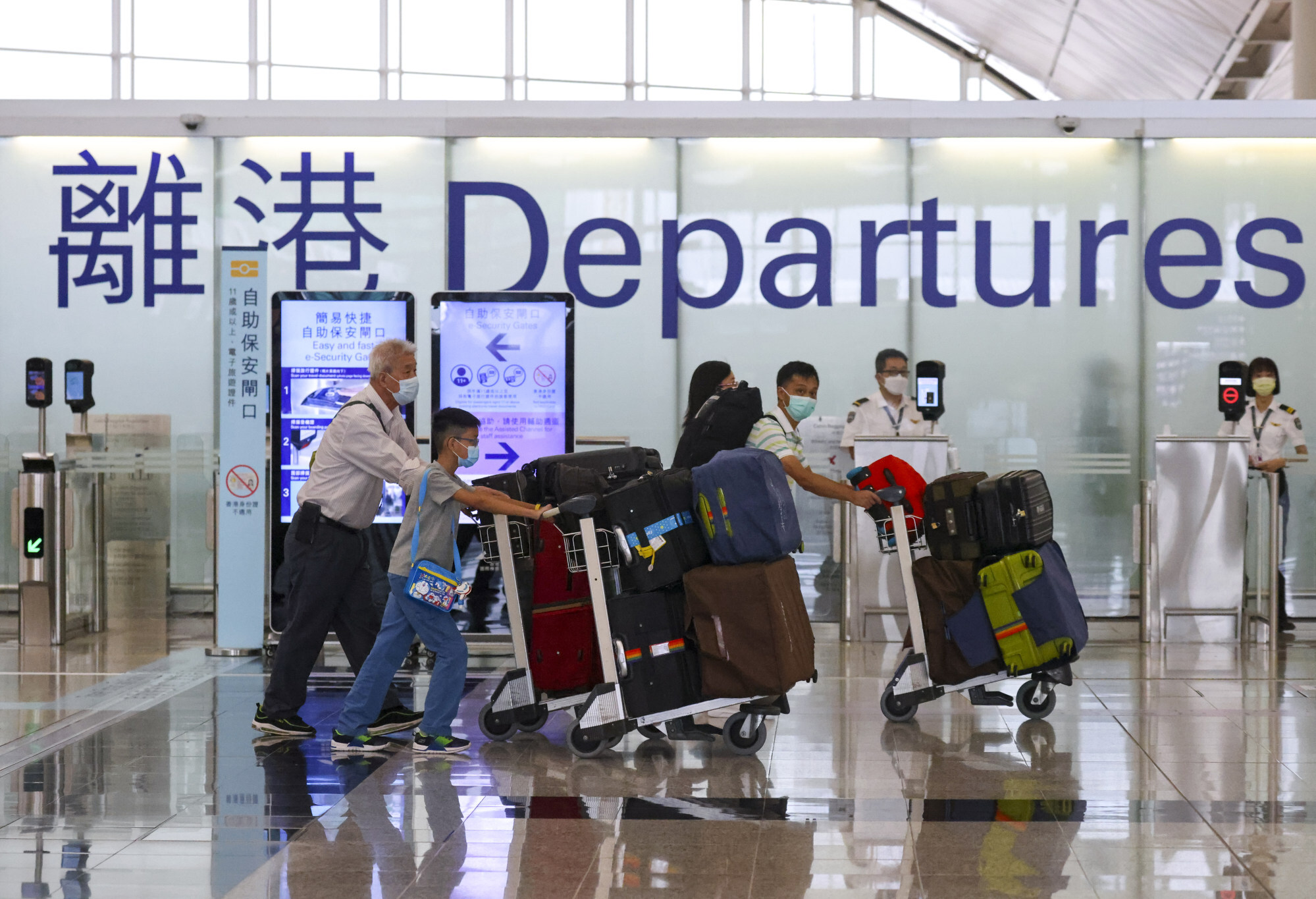 Passengers make their way through the departures terminal of Hong Kong International Airport. Photo: Dickson Lee