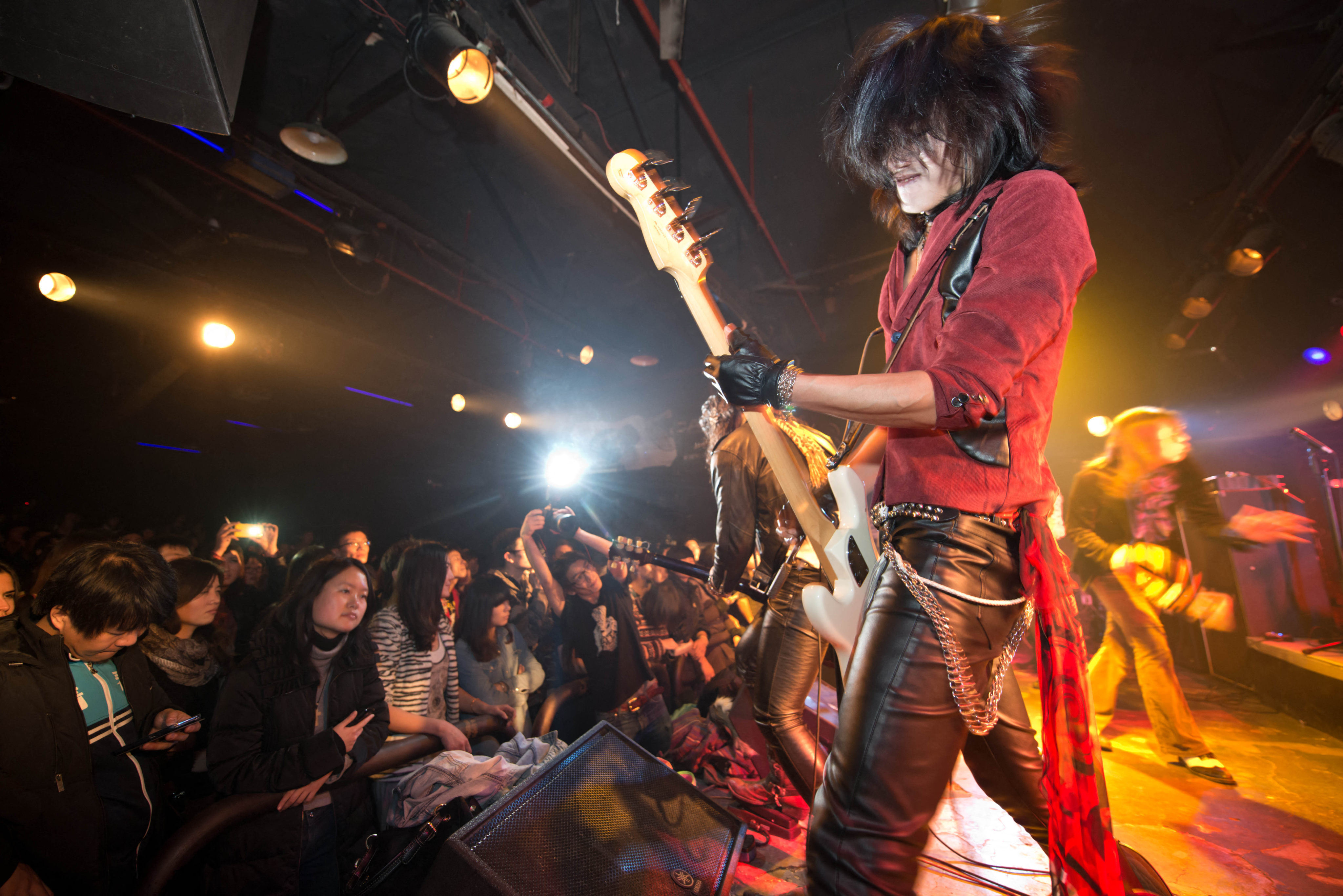 A photo taken on January 2, 2013 shows hard-rock group Los Crasher performing at the Mao Livehouse music venue in Beijing. Traditionally outcast by state radio and television, independent music acts in Beijing continue to pack out the city’s many ‘livehouse’ venues where ear-splitting bands and hard-rocking fans represent a flourishing underground live music scene irrespective of the night of the week. However, major record deals are elusive and while available sales data is thin, bands get by on what they make from concerts and fairly low-level CD sales in a market notorious for piracy.     AFP PHOTO / Ed Jones (Photo by Ed Jones / AFP)&#xA;&#xA;CREDIT:  AFP