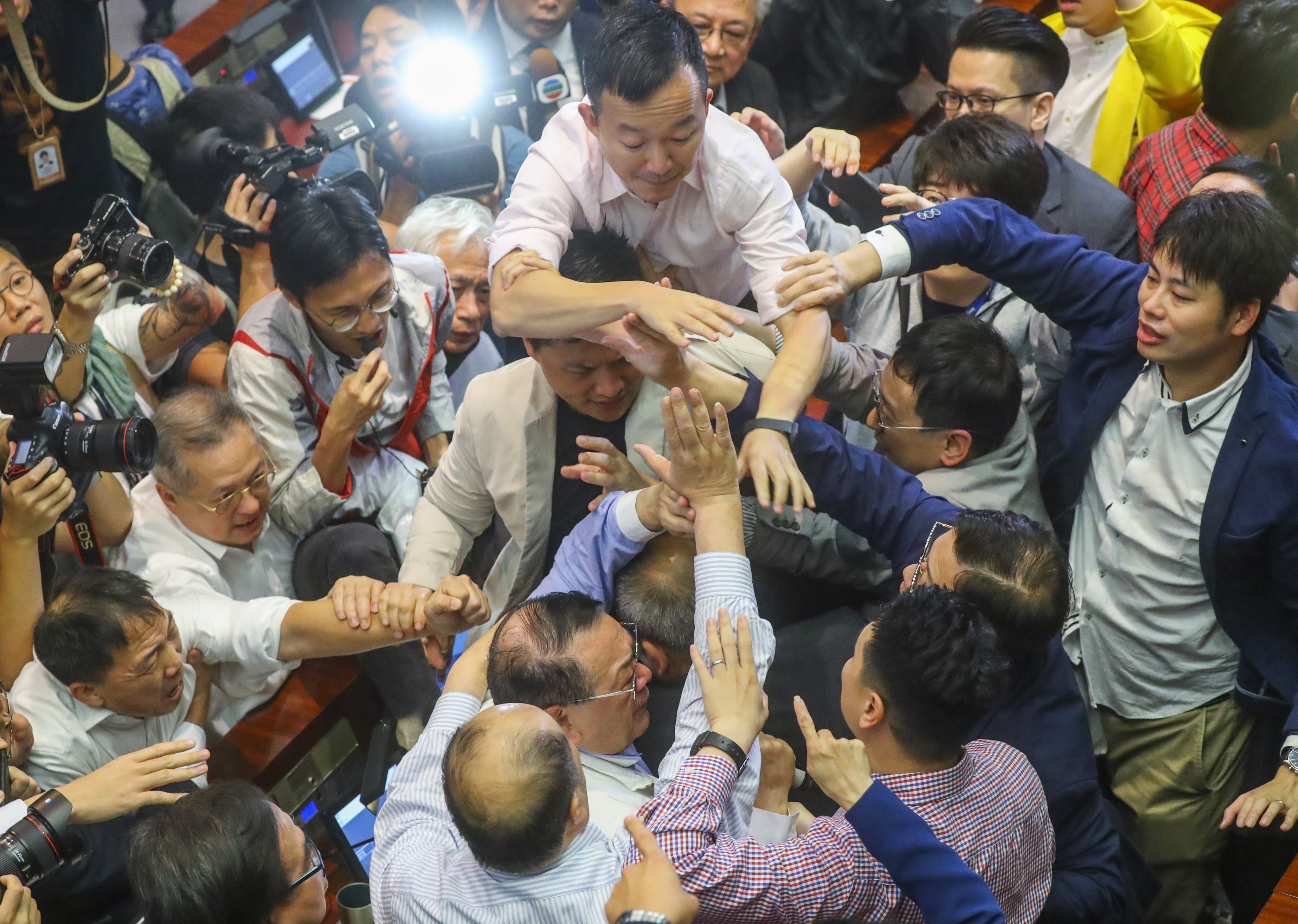 Lawmaker Abraham Razack (bottom centre) is surrounded by other legislators during a meeting on the Fugitive Offenders Bill at the Legislative Council on May 11, 2019. Beijing lost patience with the shenanigans in Legco. Photo: Edmond So