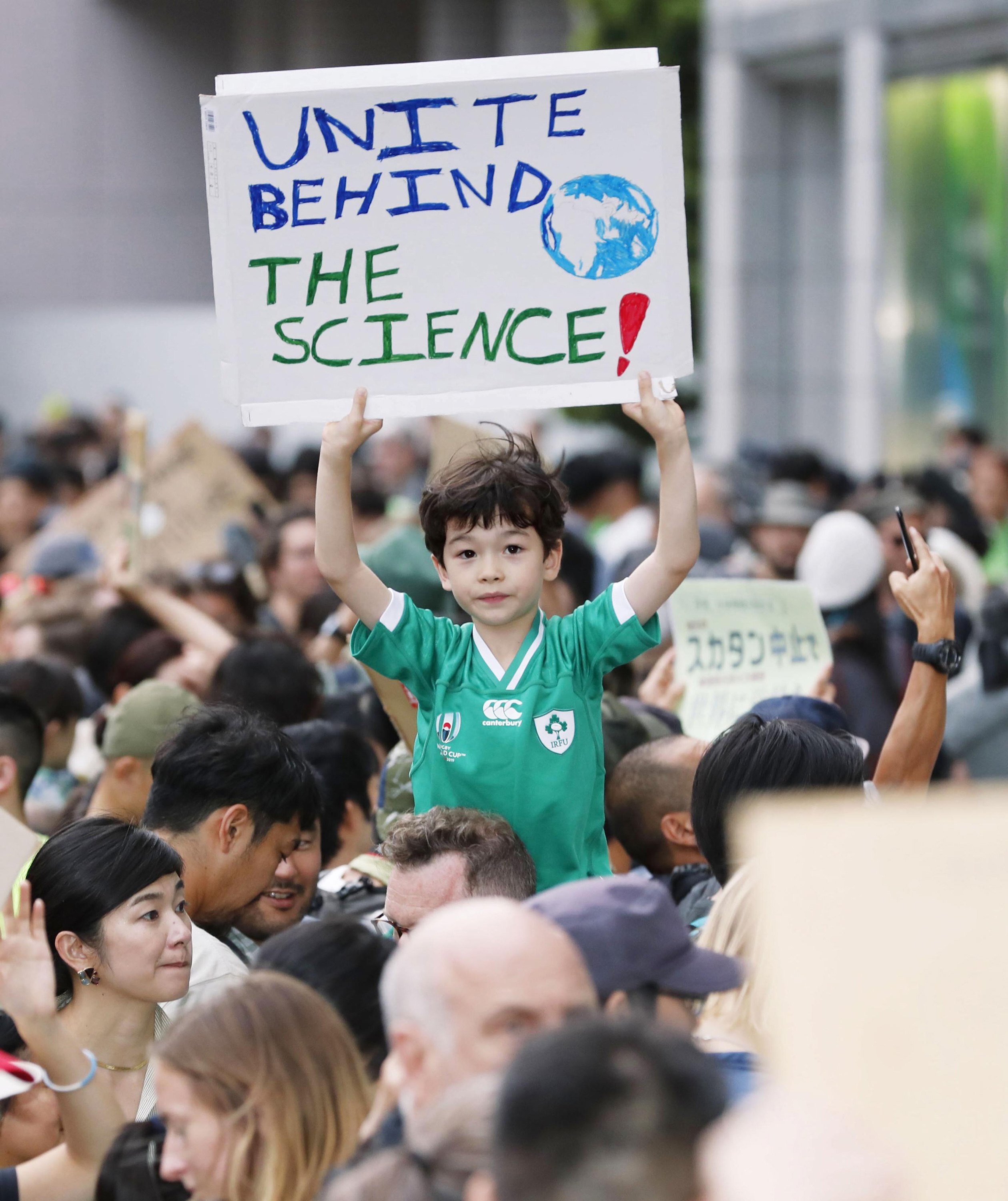 A boy joins the climate change rally in Tokyo, Japan on September 20, 2019. Photo: Kyodo News