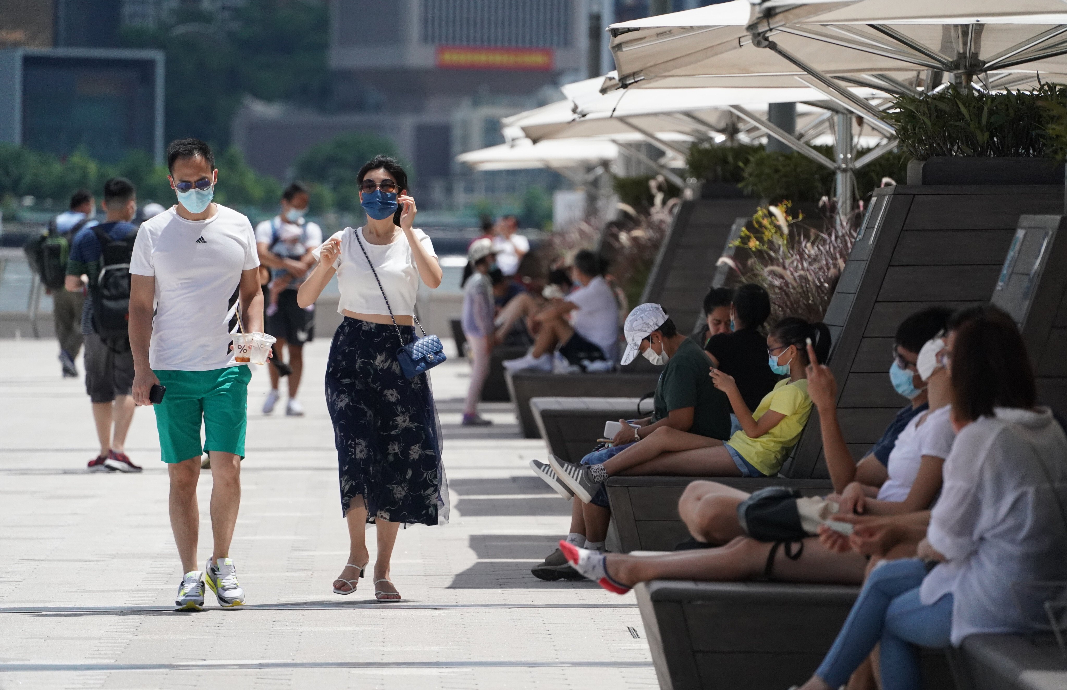 Hongkongers out and about along the Tsim Sha Tsui waterfront on July 11. Photo: Felix Wong