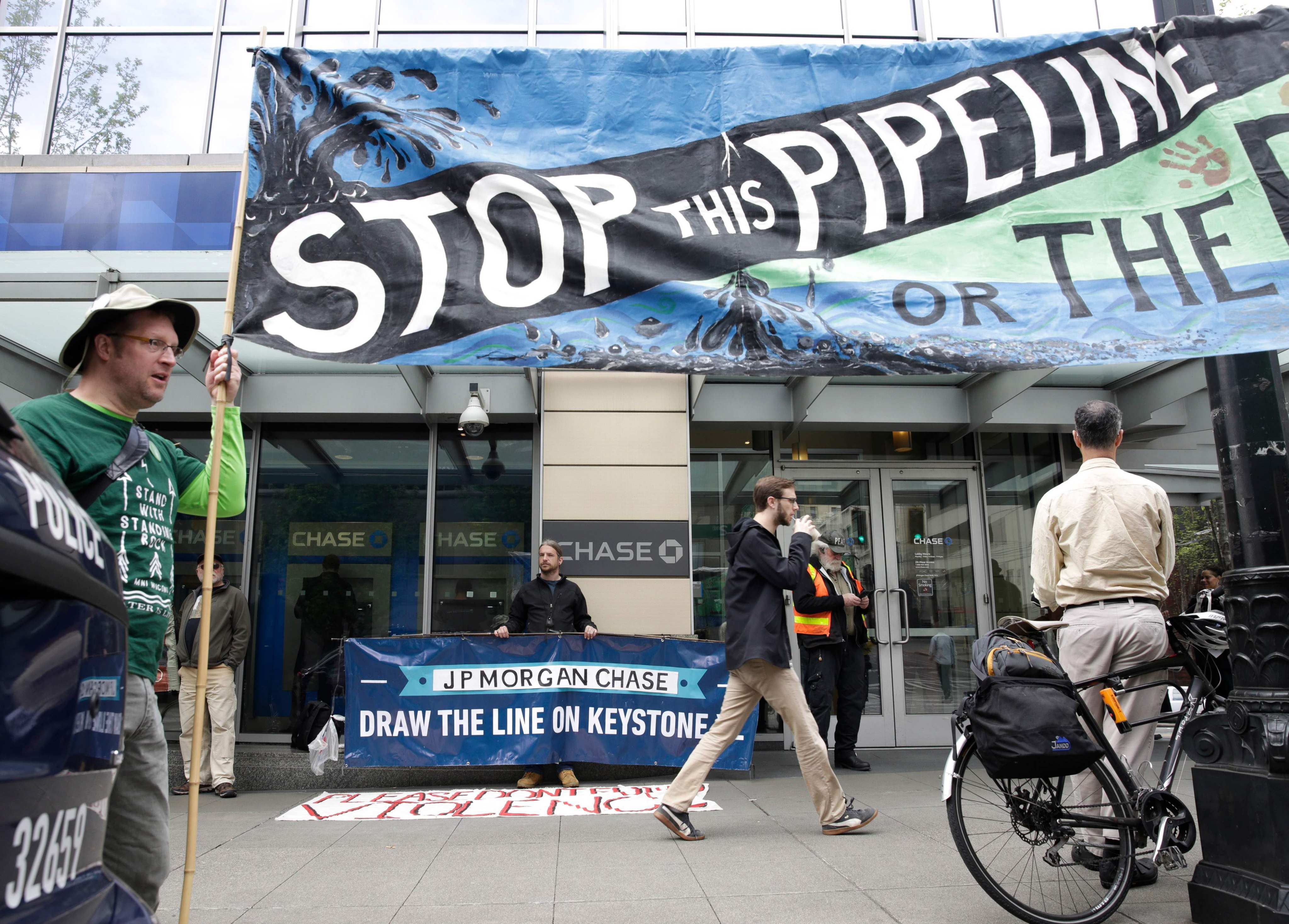 Indigenous leaders and climate activists protest against the Keystone XL oil pipeline in Seattle on May 8, 2017. Biden has revoked the project’s permit as he pursues climate-friendly policies to meet the demands of the Democratic Party’s Green New Deal base. Photo: AFP