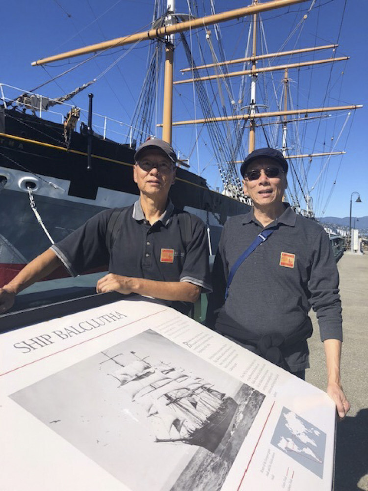 James Chiao (left) and Philip Chiao in front of the Star of Alaska, which was once used as a merchant ship to transport Chinese and Asian workers to Alaska salmon canneries. Photo: Courtesy of James and Philip Chiao