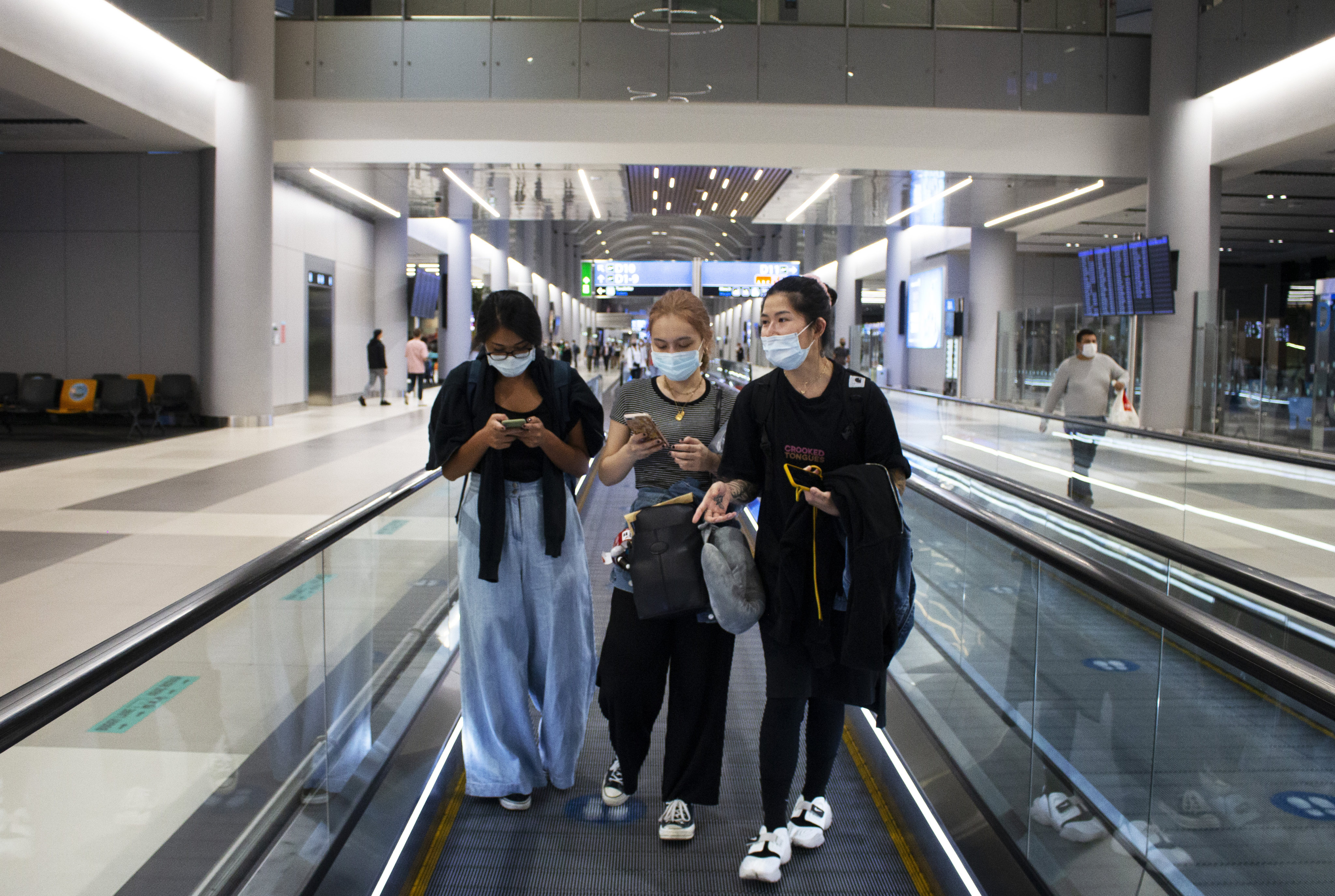 (From left) Rong Jia, Olivia and Ku at Taoyuan International Airport in Taiwan before the first flight in their journey to France to be with their partners. Photo: Chi-Hui Lin