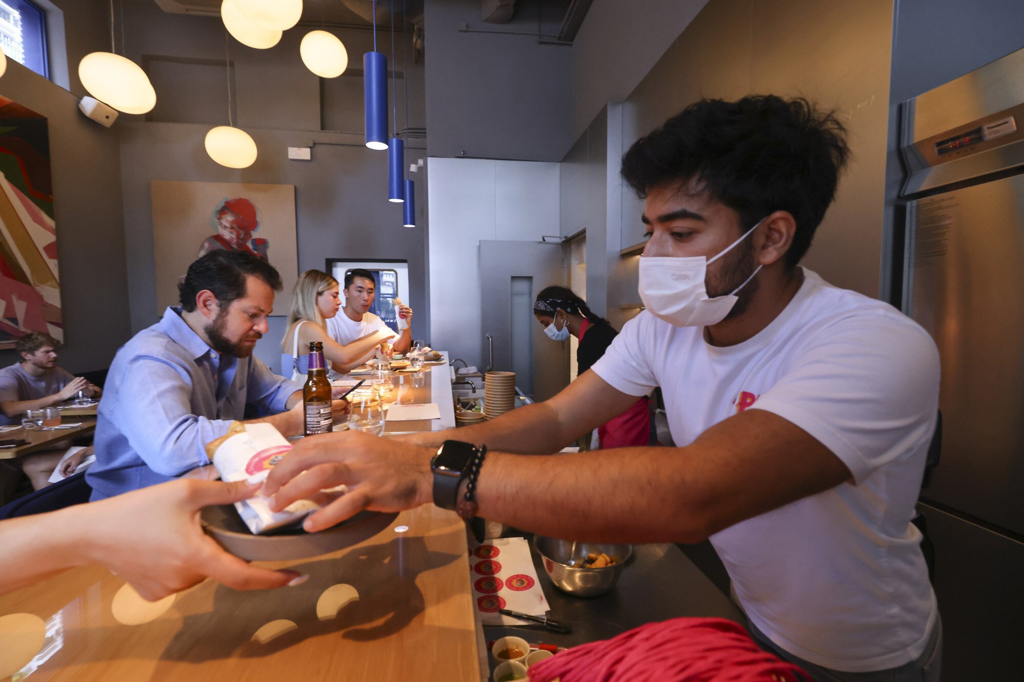 Vidur Yadav serving meals at Hatch. Photo: Dickson Lee