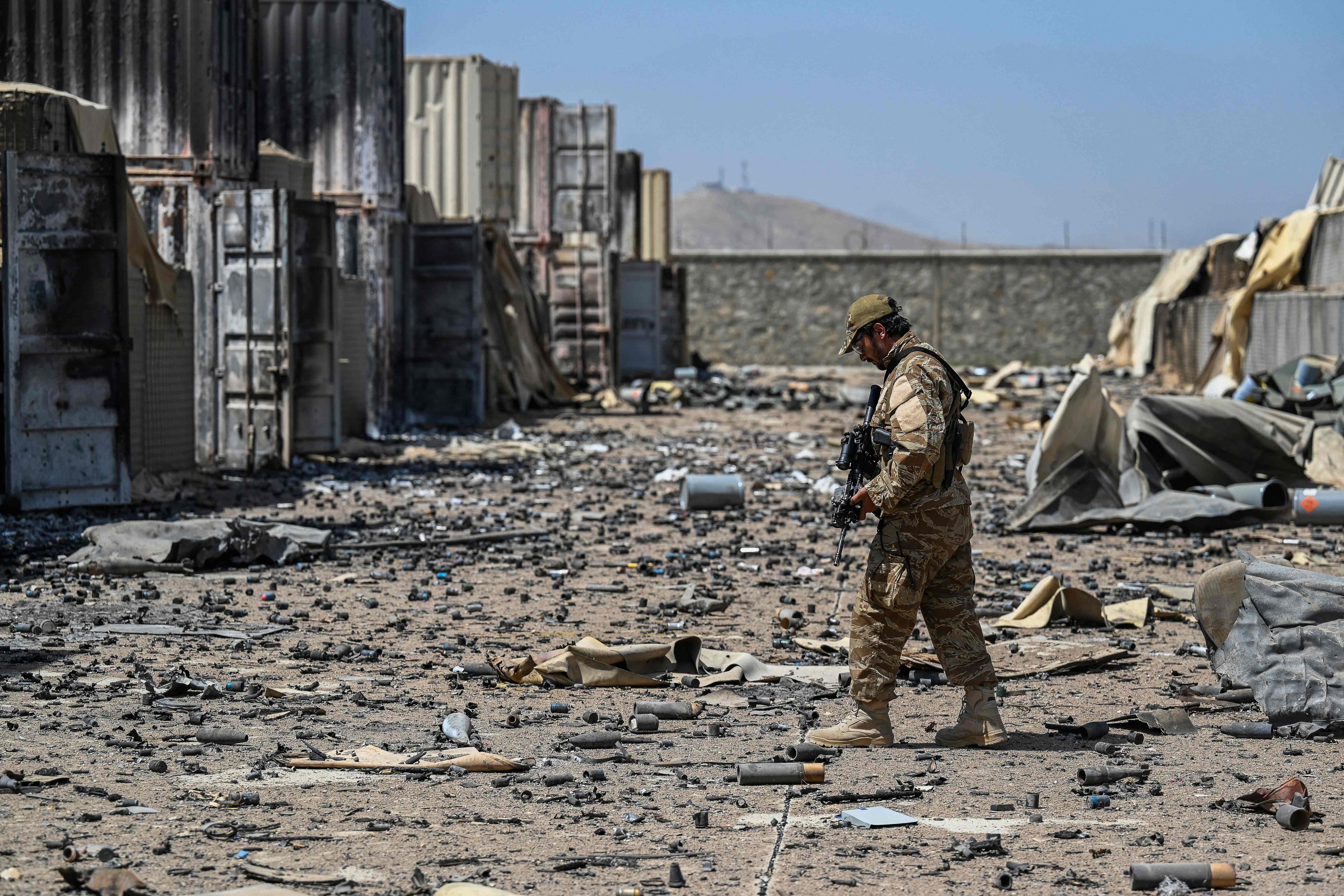 A member of a Taliban military unit walks amid debris of the destroyed Central Intelligence Agency base in Deh Sabz district, northeast of Kabul, Afghanistan, on September 6. Photo: AFP