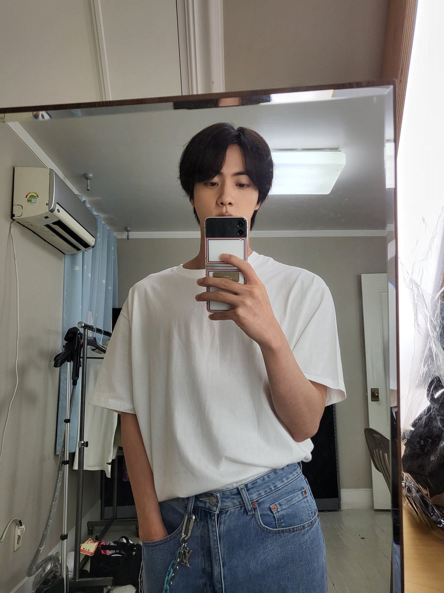 BTS Jin with his Galaxy Z Flip 3 Thom Browne Edition. Photo: @BTS_twt/ Twitter