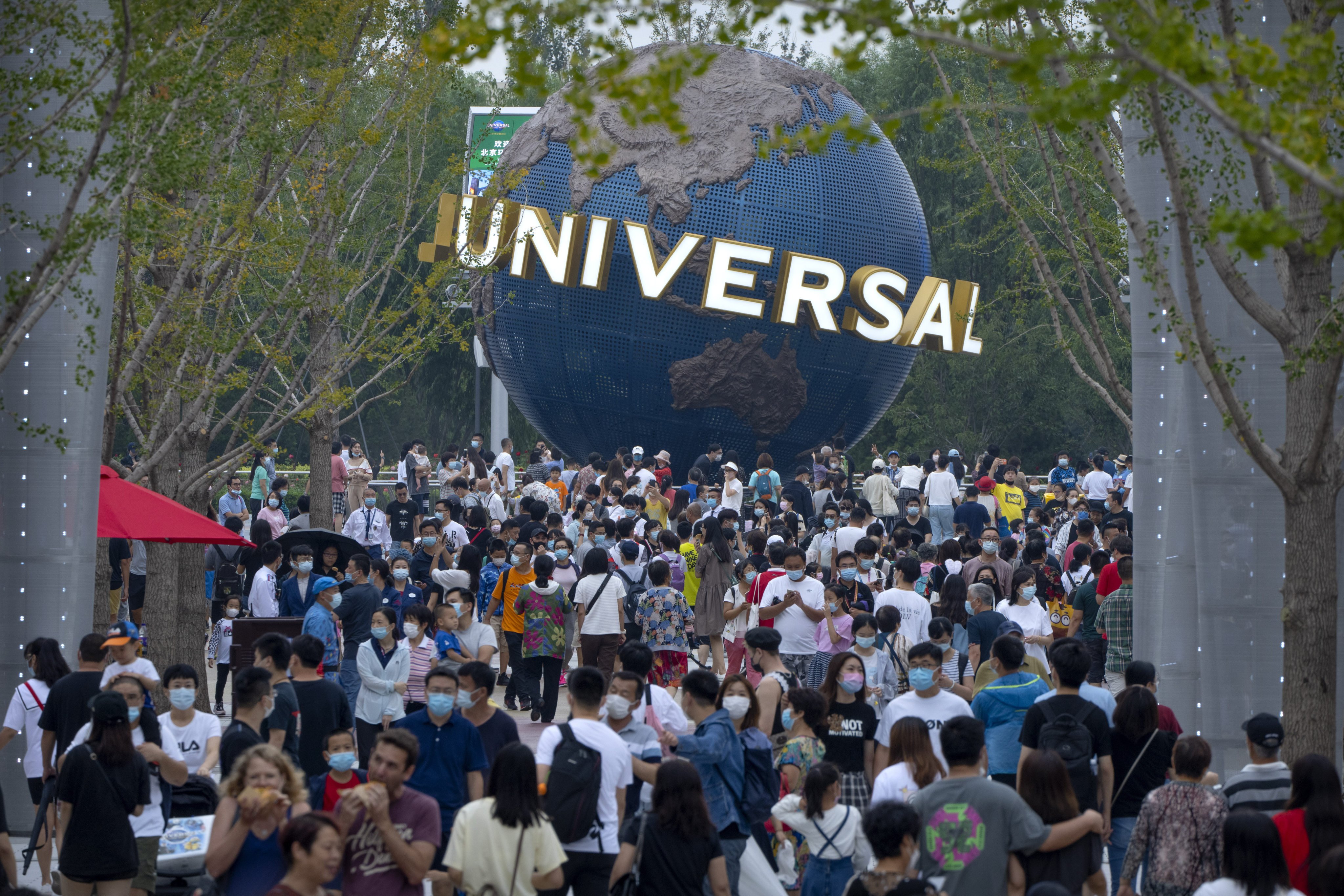Crowds flock to Universal Studios Beijing after its soft opening. The opening of the theme park is the latest symbol of the interconnectedness between China and the US. Photo: AP 