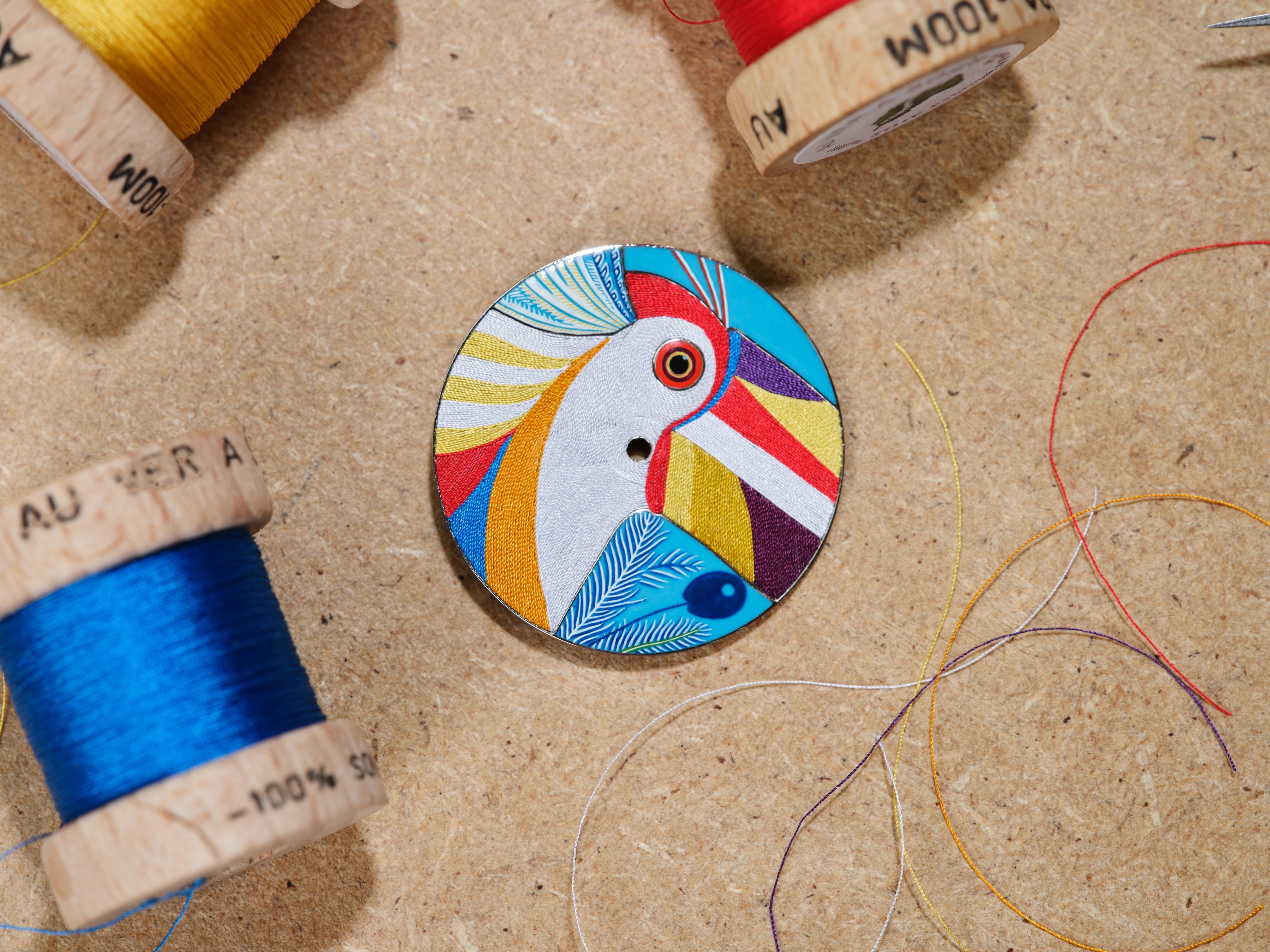 The dial for the Hermès Arceau Toucan de Paradis watch, crafted with silk thread from Agnès Paul-Depasse. Photo: David Marchon
