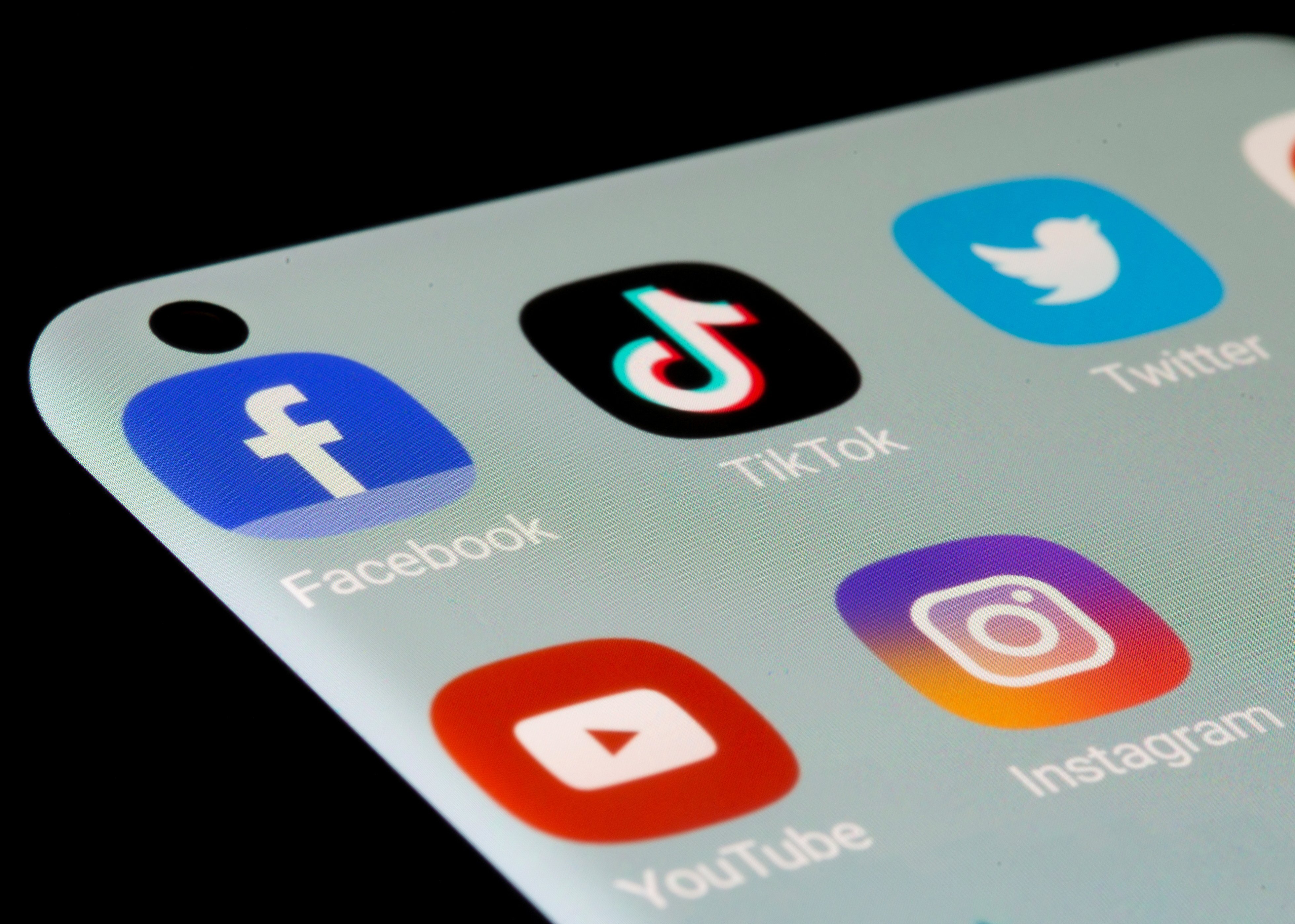 Social media apps Facebook, TikTok, Twitter, YouTube and Instagram are seen on a smartphone. The major internet media argue that they have the private property right to determine what appears on their electronic pages and what does not. They are right. Photo: Reuters