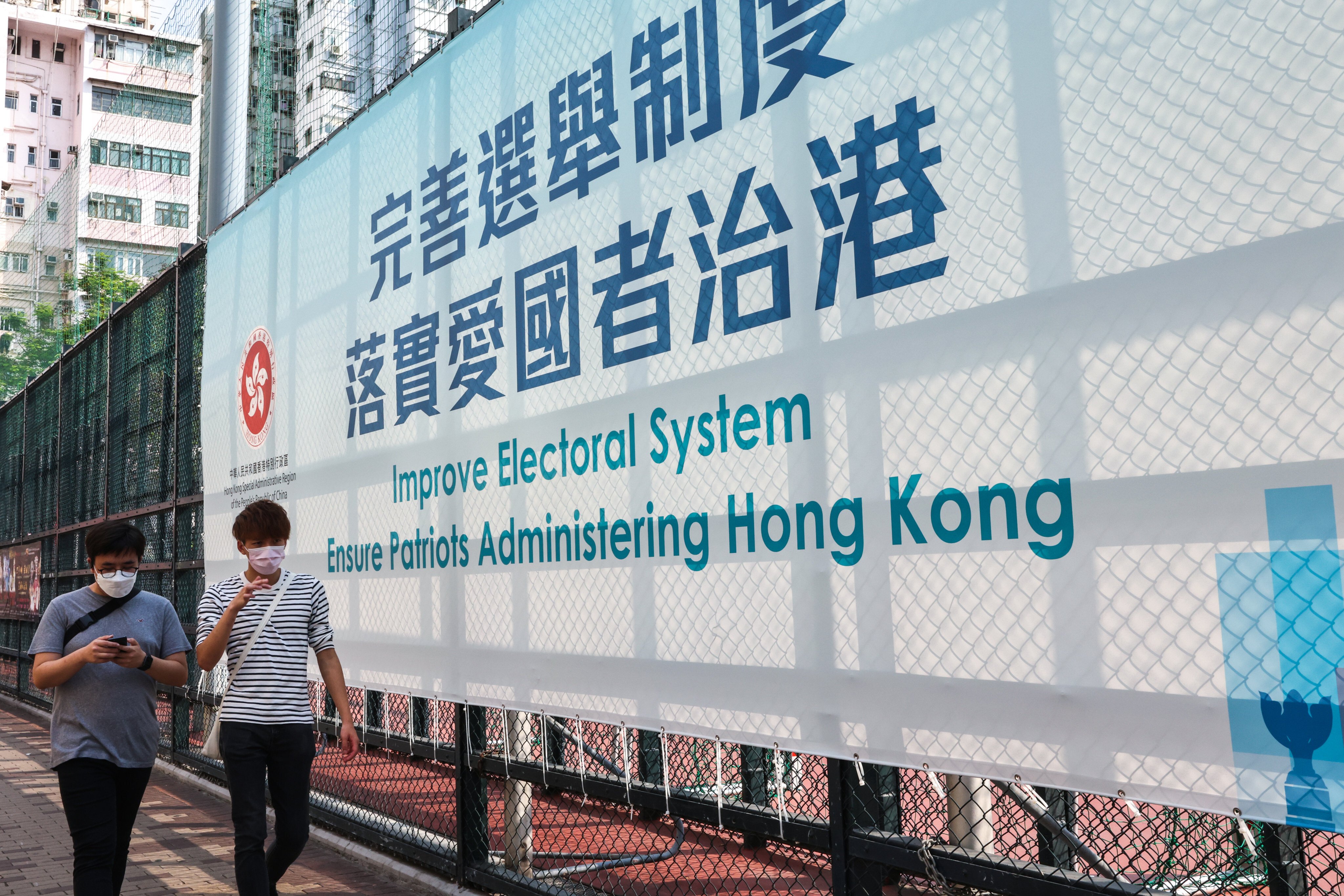 A government banner promoting electoral changes outside Maple Street playground at Sham Shui Po on March 31. The electoral reform process is clearly intended to remove the adverse effects of crony capitalism. Photo: K.Y. Cheng