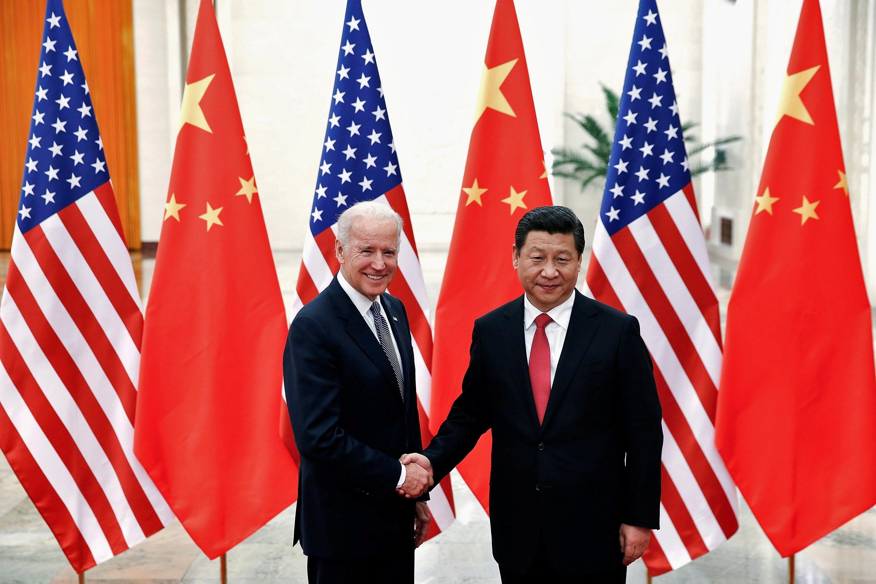 Chinese President Xi Jinping shakes hands with US President Joe Biden in 2013, when Biden was vice president. Photo: Reuters