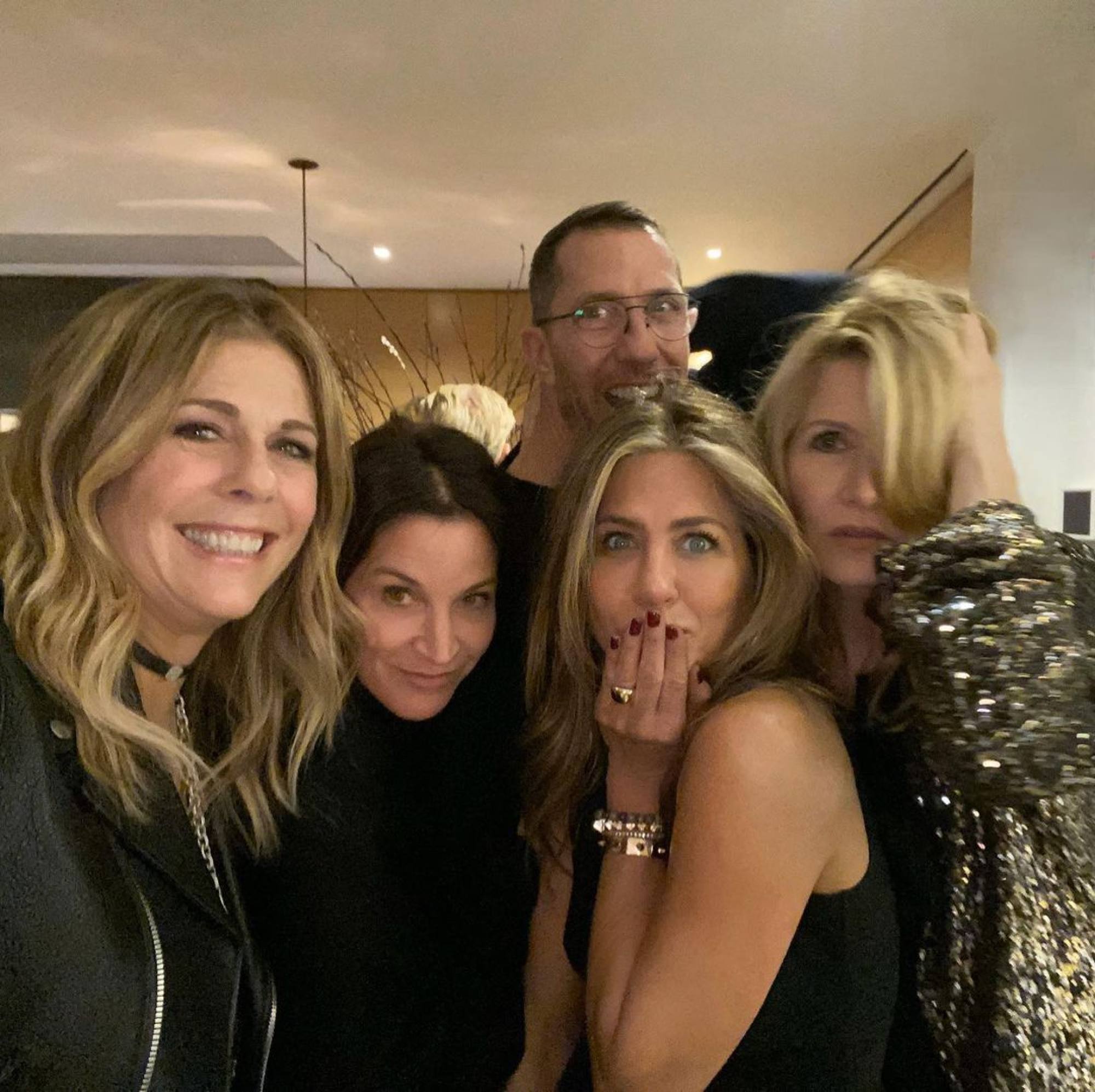 Jennifer Aniston shows off some Christmas sparkle alongside her friends, including hair stylist Chris McMillan. Photo: @jenniferaniston/Instagram
