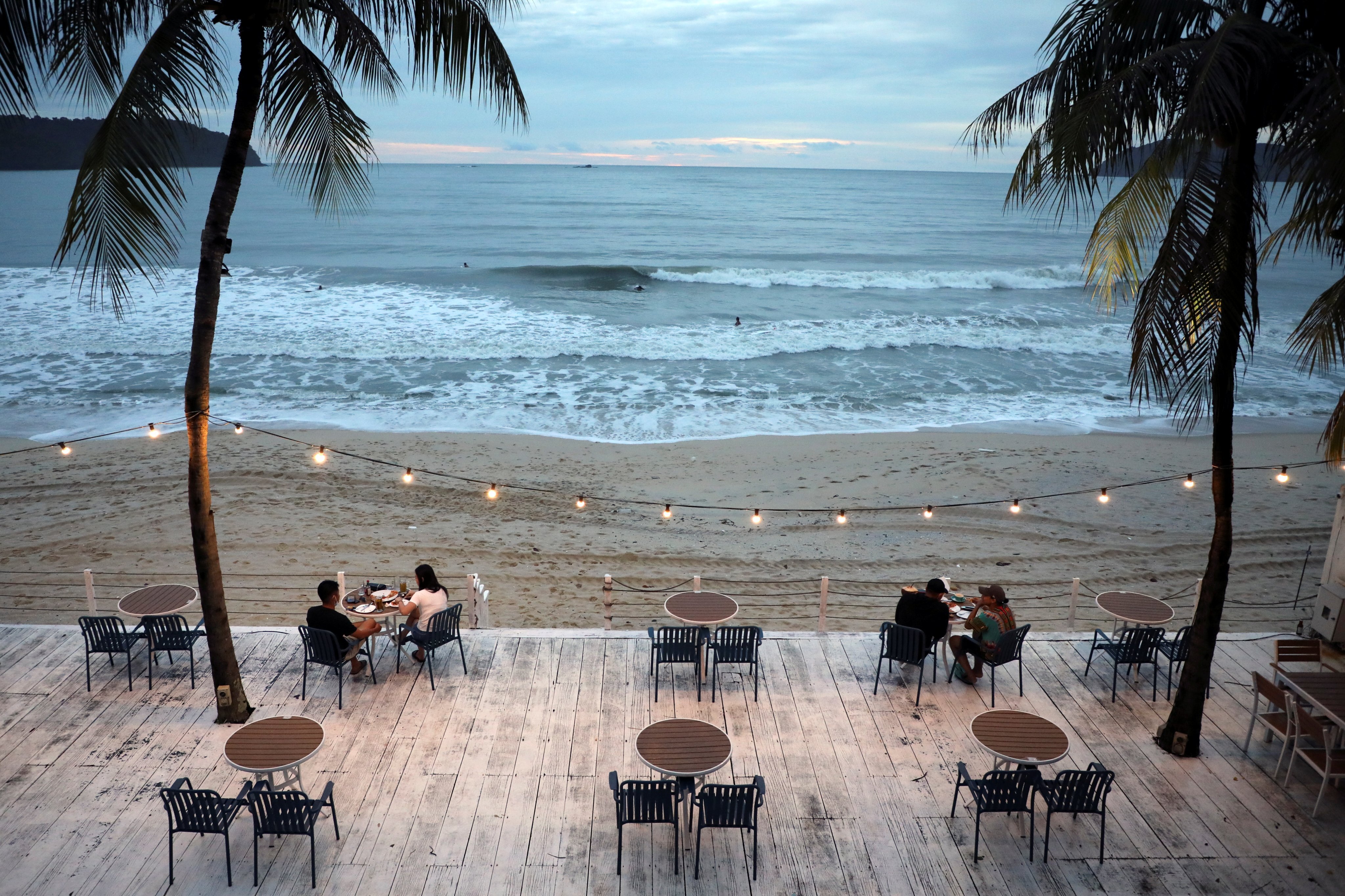 People dine at a restaurant following social distancing measures on September 13 as Langkawi prepared to open to domestic tourists in Malaysia from September 16. Photo: Reuters