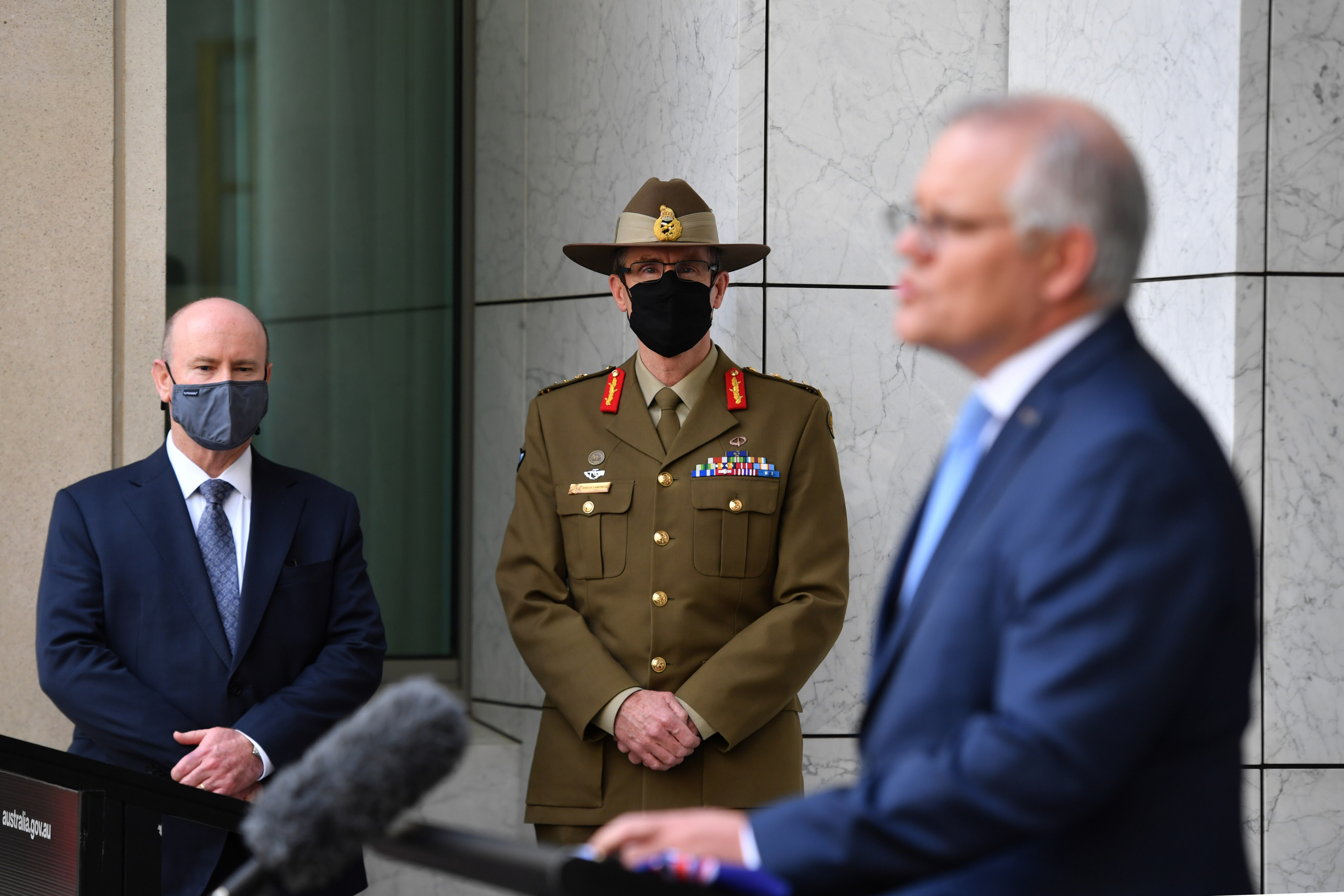 (From the left) Australian Defence Secretary Greg Moriarty, Chief of the Australian Defence Force General Angus Campbell and Prime Minister Scott Morrison at a press conference at Parliament House in Canberra, on September 16. Photo: AAP