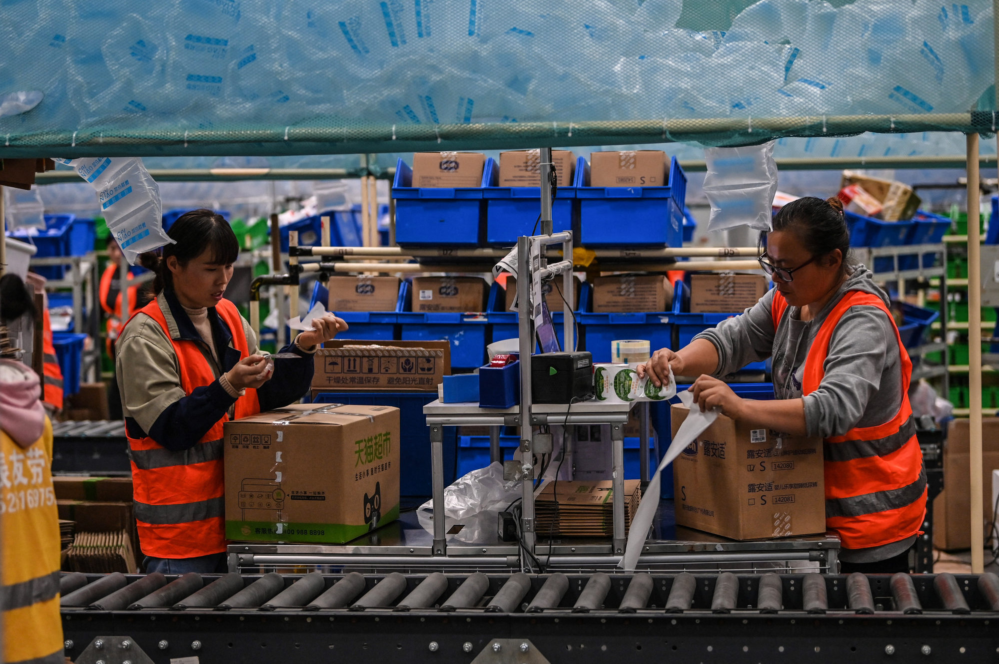 Employees work in the warehouse of Cainiao Smart Logistics Network, the logistics affiliate of e-commerce giant Alibaba, in Wuxi, China’s eastern Jiangsu province, on November 6, 2020, ahead of Singles’ Day on November 11. The logistics sector is well placed to capitalise on the importance of high-end manufacturing in China. Photo: AFP