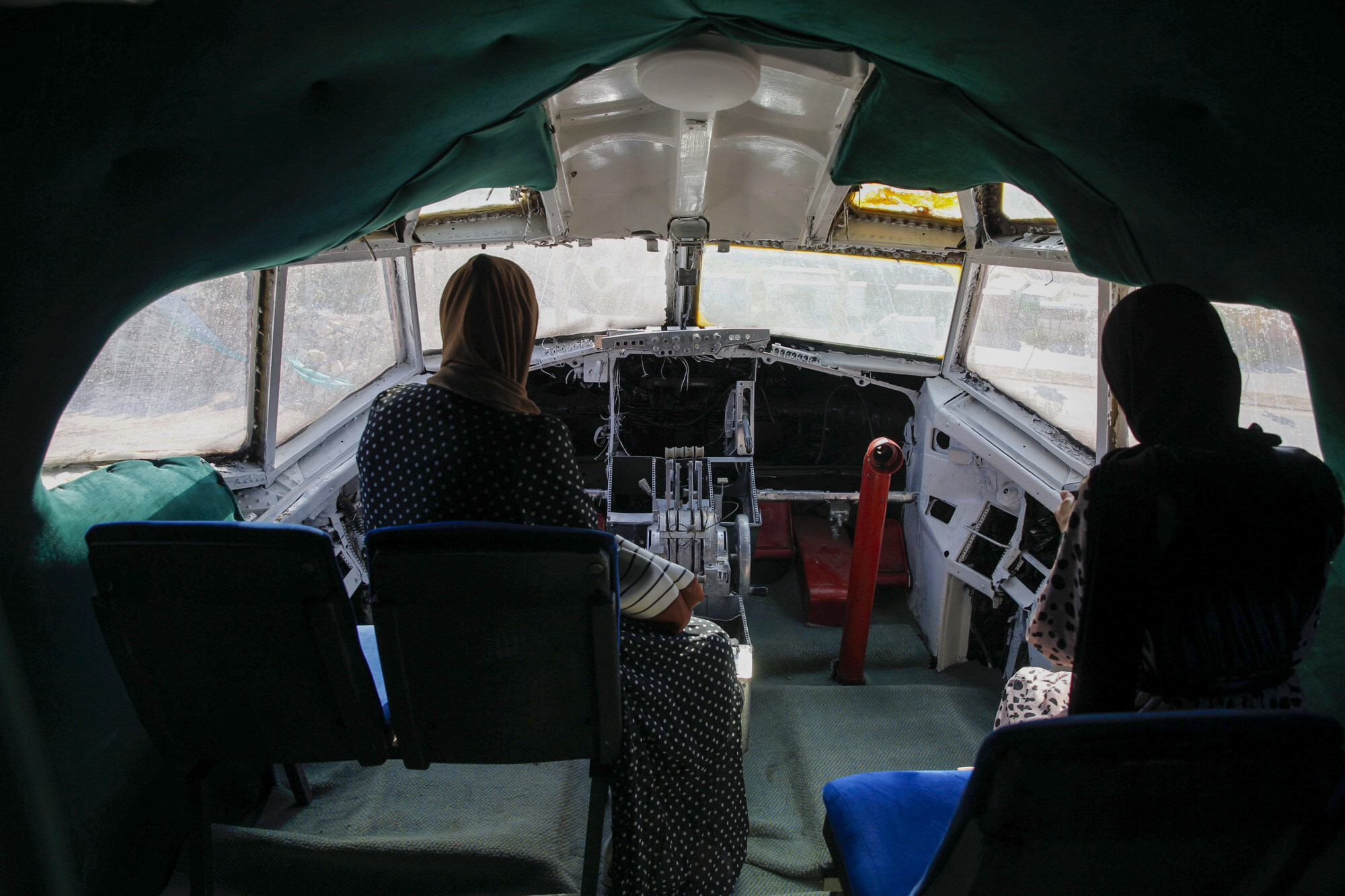 Visitors sit in the cockpit of the converted Boeing. Photo: AP