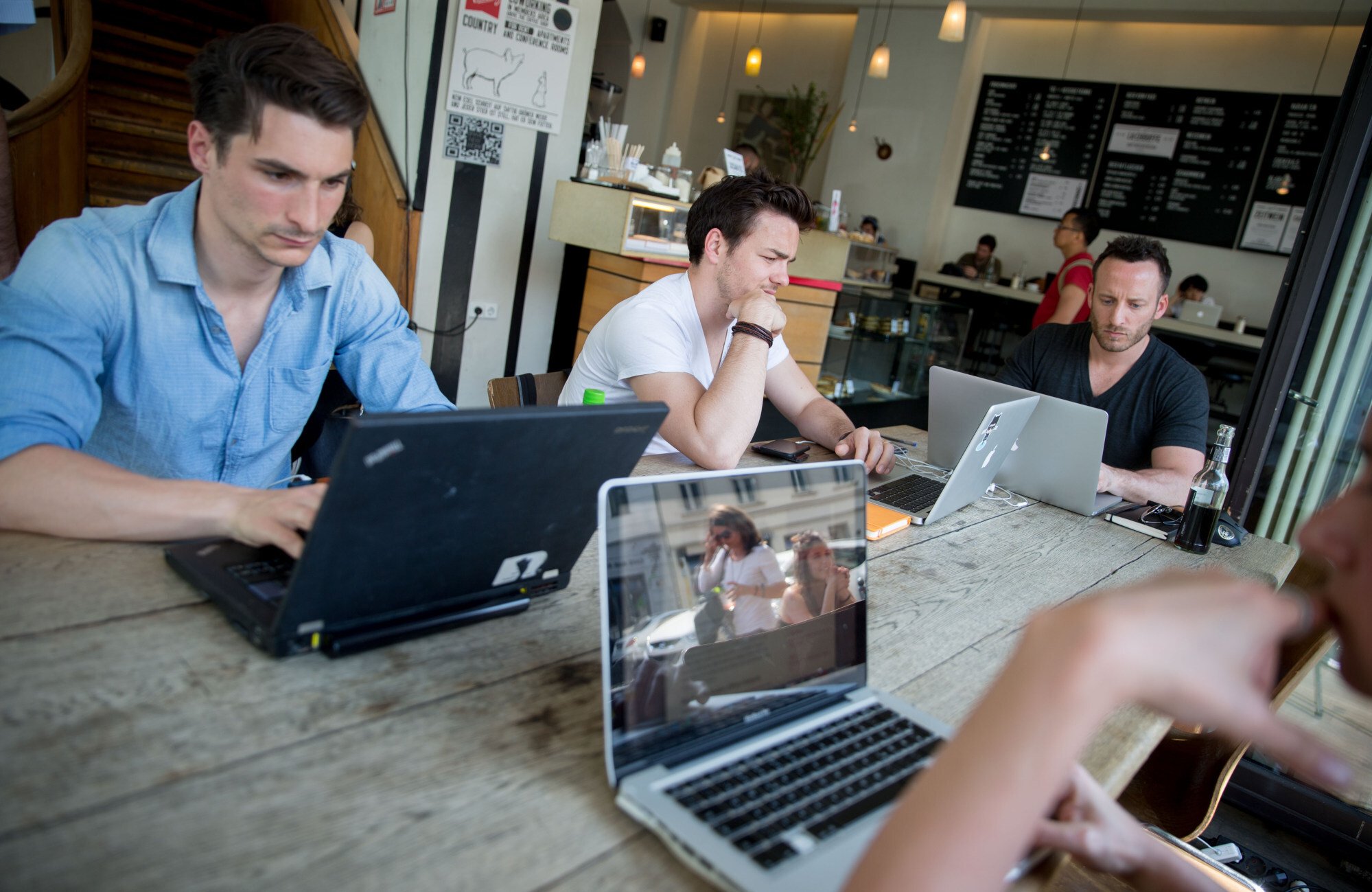 Customers work on their laptops at the St Oberholz cafe in Mitte, Berlin. Photo: Getty Images