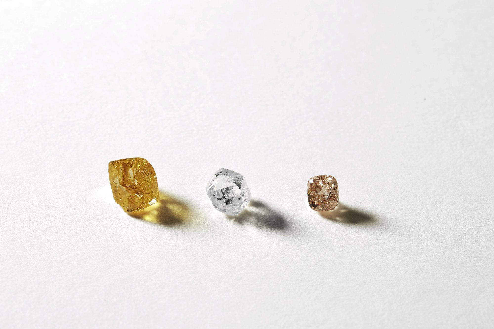 The different stages of a diamond: from rough to polished.