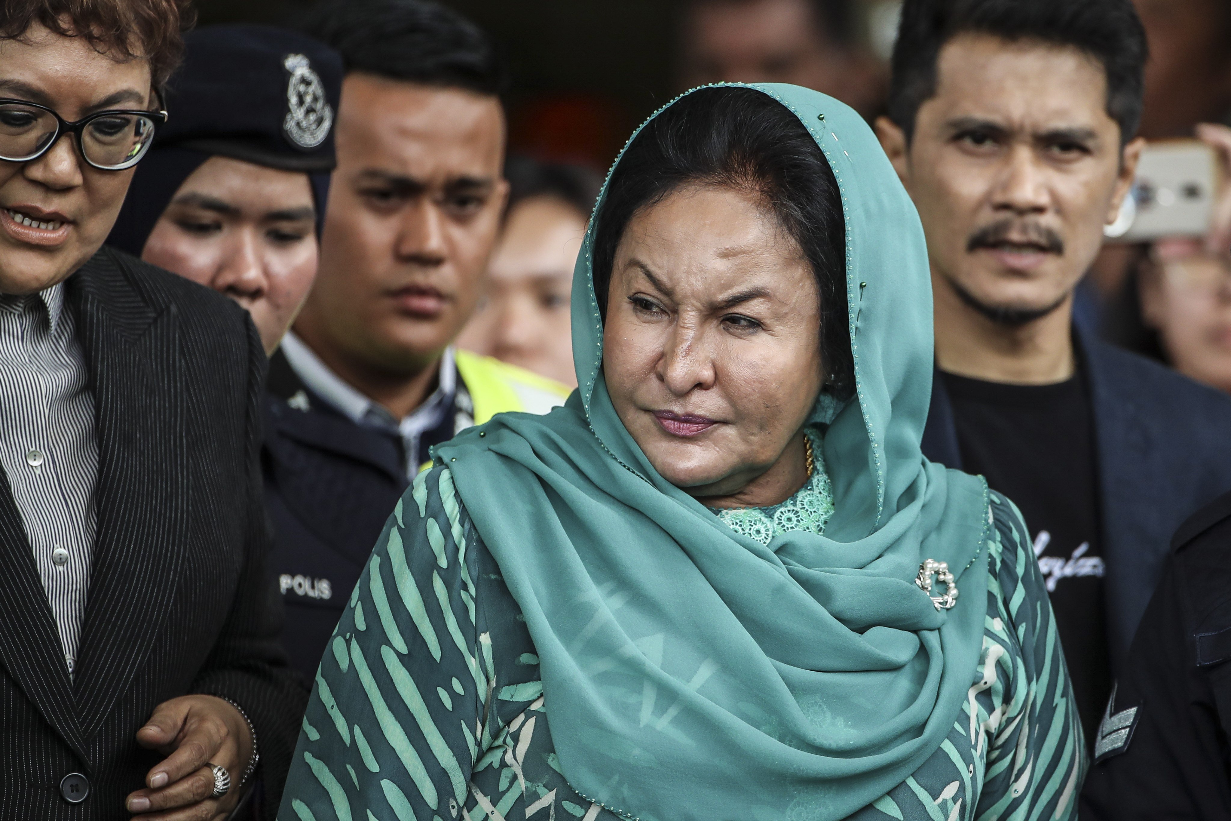 Rosmah Mansor (centre), wife of former Malaysian prime minister Najib Razak, leaves the Kuala Lumpur High Court on April 10, 2019 where she faced corruption charges in relation to misappropriation with regards to a solar panel project for rural schools in Sarawak. Photo: EPA-EFE