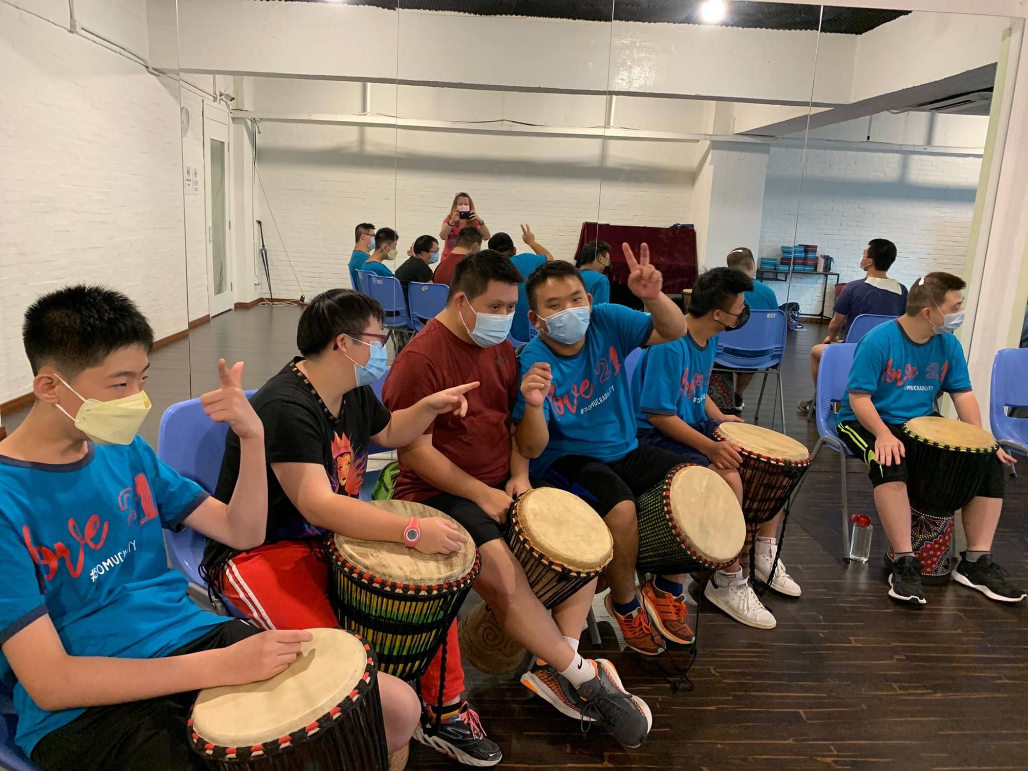 Love 21 members take part in a music session.