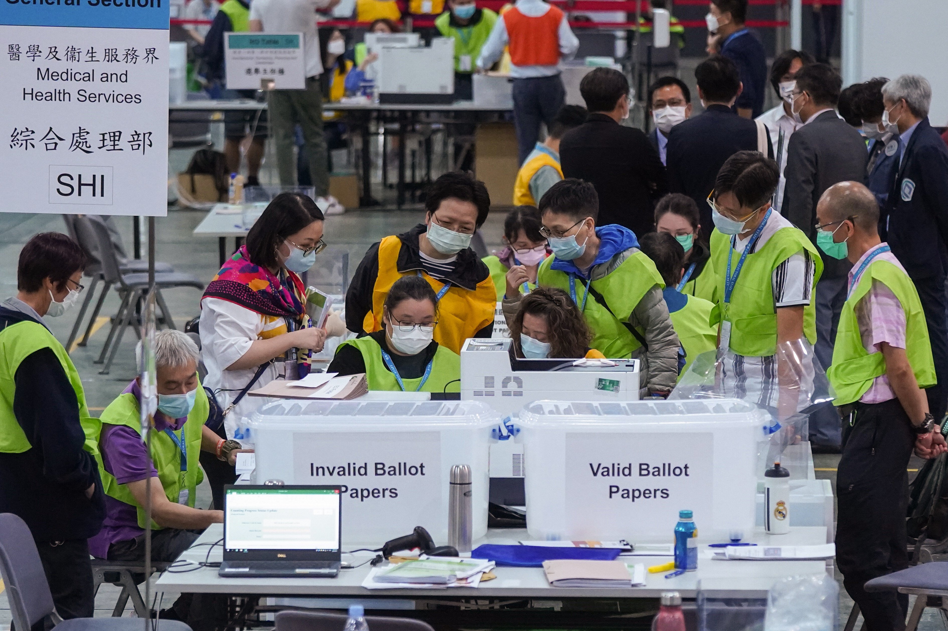 Government officers count ballots for the Election Committee poll on September 20. Photo: Sam Tsang