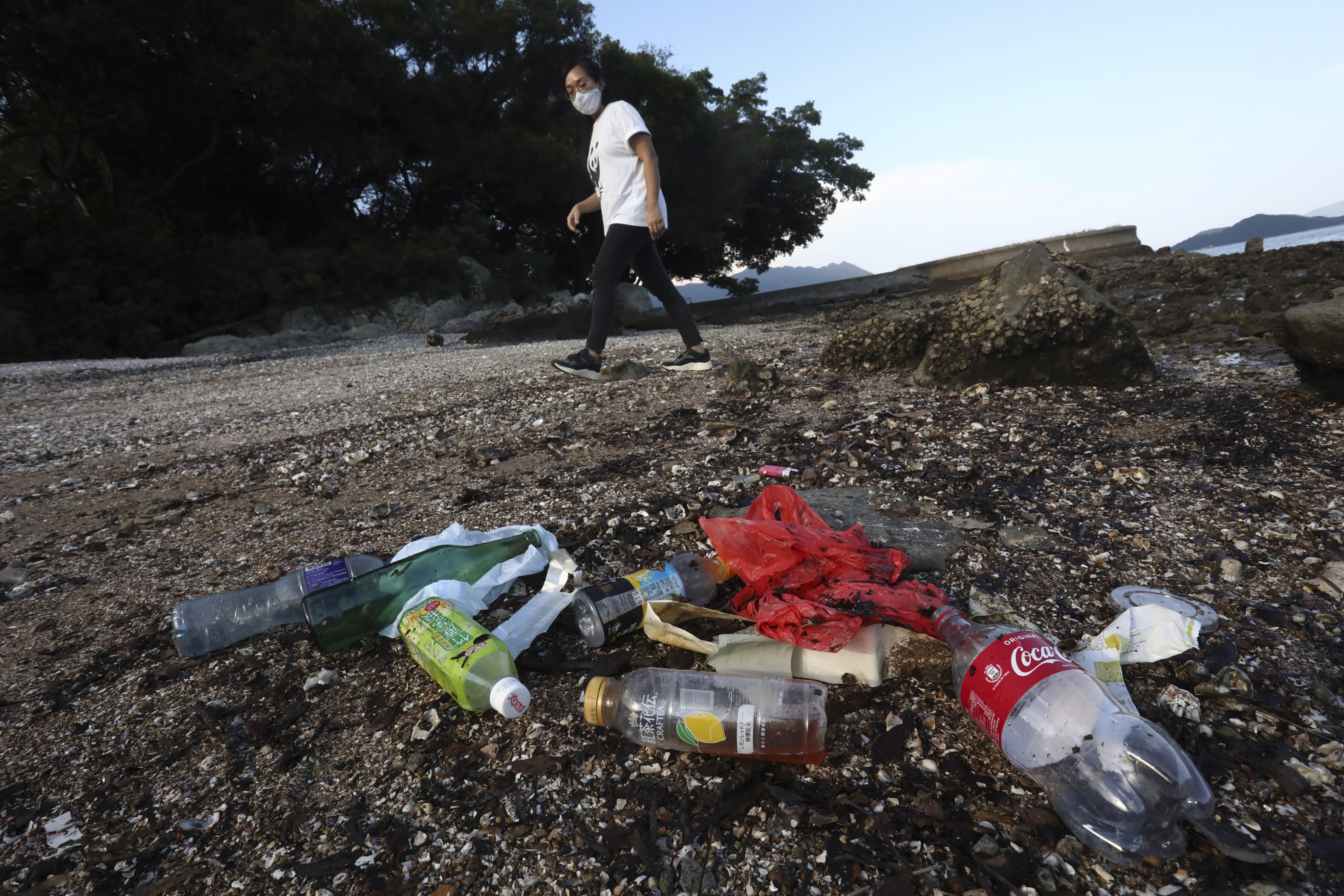 June Wong So-kwan picks up plastic waste on Hong Kong’s beaches, but is the city doing enough to reduce the amount of plastic that washes into the ocean? Photo: Jonathan Wong