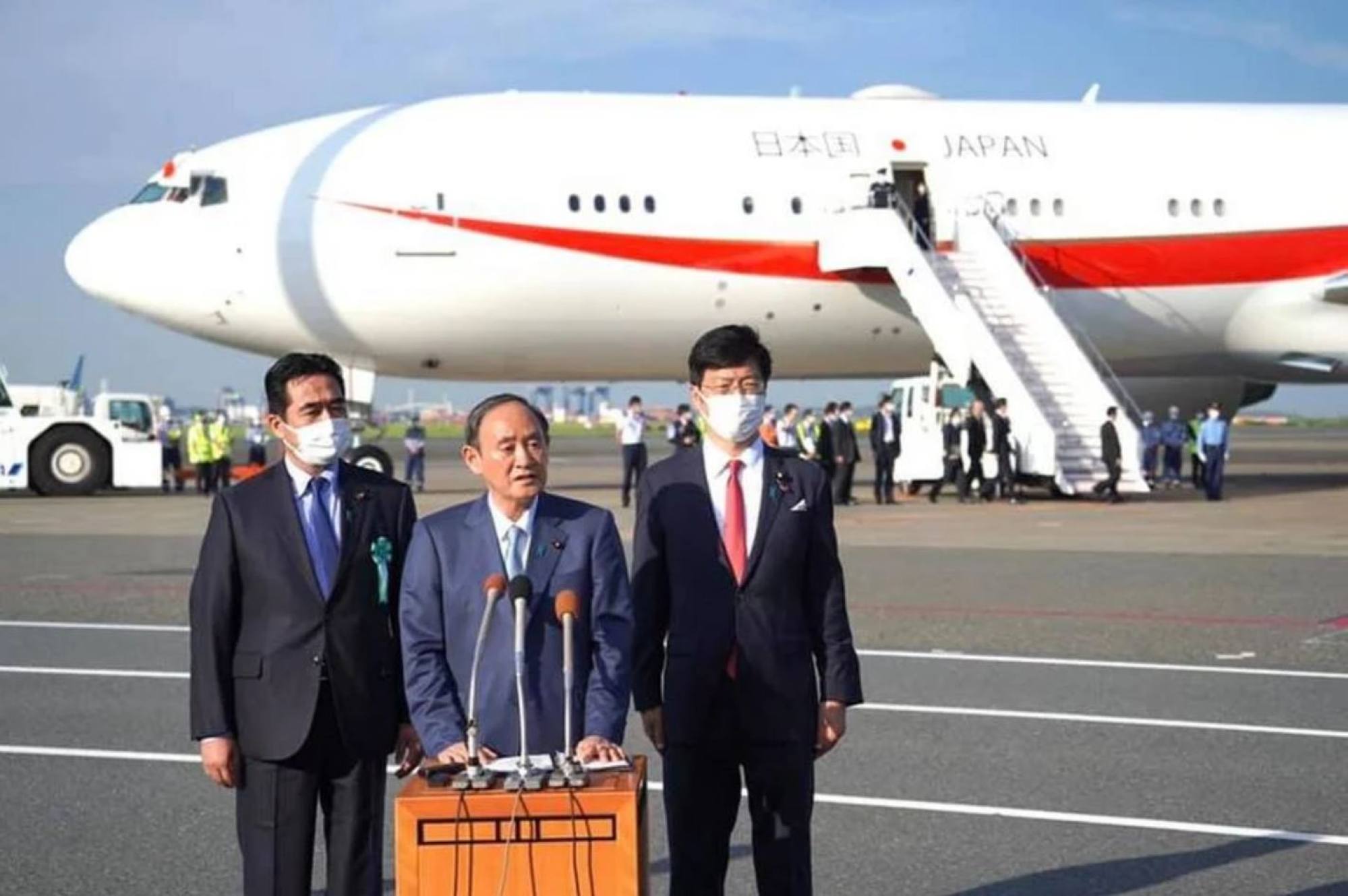Yoshihide Suga talks in front of one of his many aeroplanes. Photo: Prime Minister’s Office of Japan/Facebook