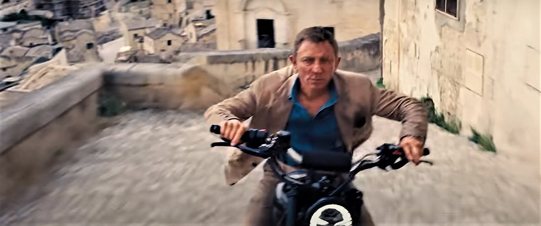 A still of Daniel Craig from a scene in No Time to Die shot in Matera, Italy.