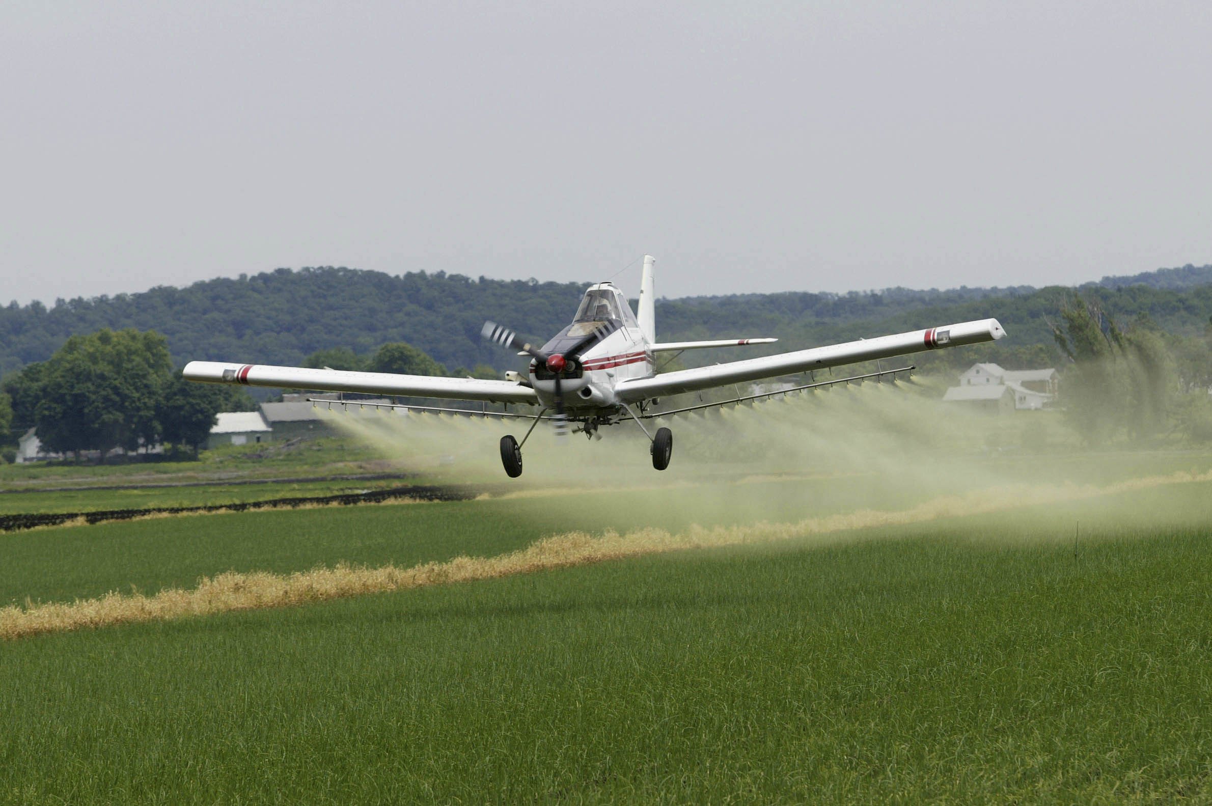 A crop-spraying plane in action. In his new book Earth Detox, Australian science writer Julian Cribb warns of a “man-made chemical assault on ourselves and life on Earth”. Photo: Tony  Savino/Corbis via Getty Images