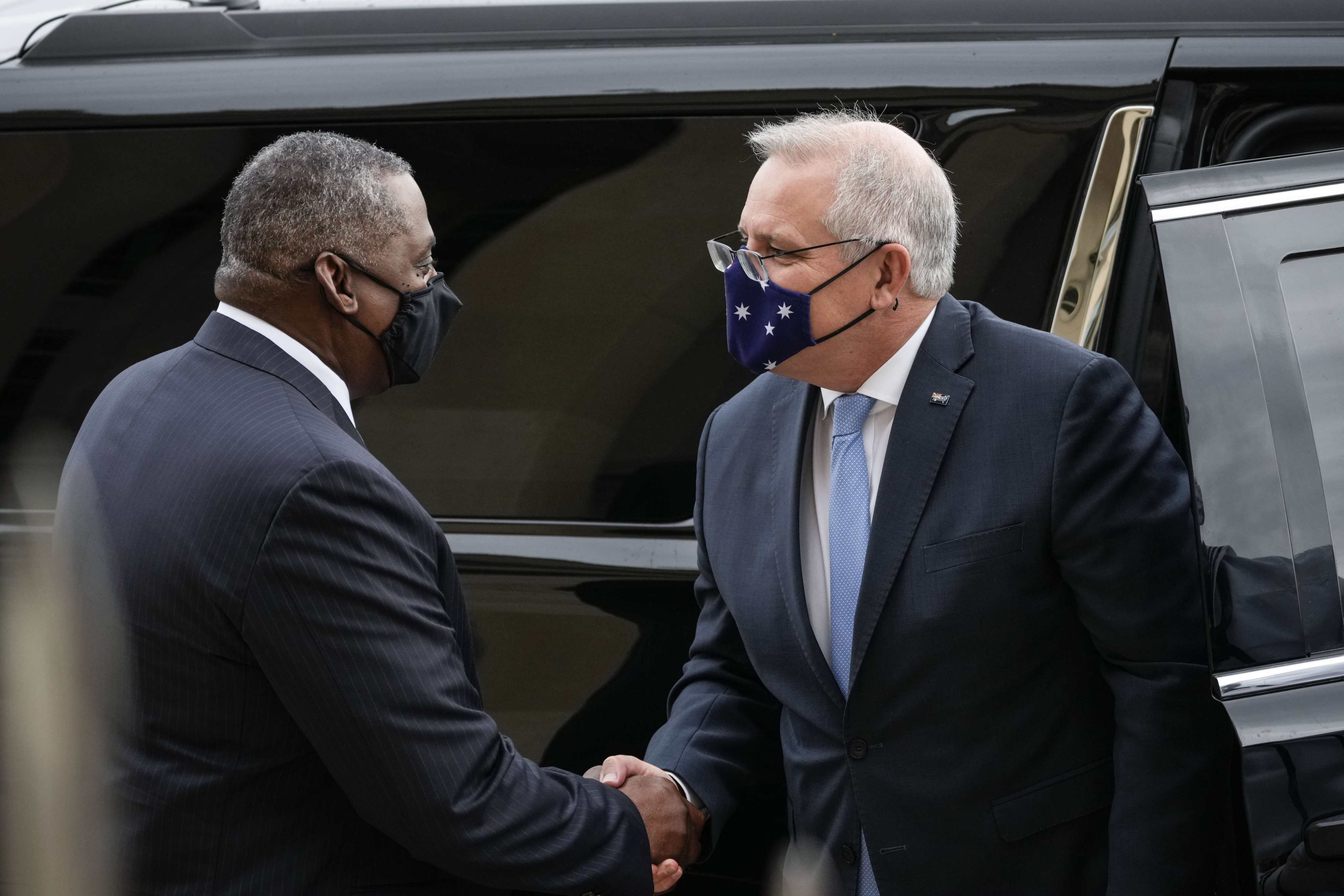 US Secretary of Defence Lloyd Austin (left) greets Australian Prime Minister Scott Morrison as he arrives at the Pentagon in Arlington, Virginia, on September 22. In mid-September, Australia, the United States and the United Kingdom announced a security pact, Aukus, to help Australia develop and deploy nuclear-powered submarines, in addition to other military cooperation.   Photo: AFP
 