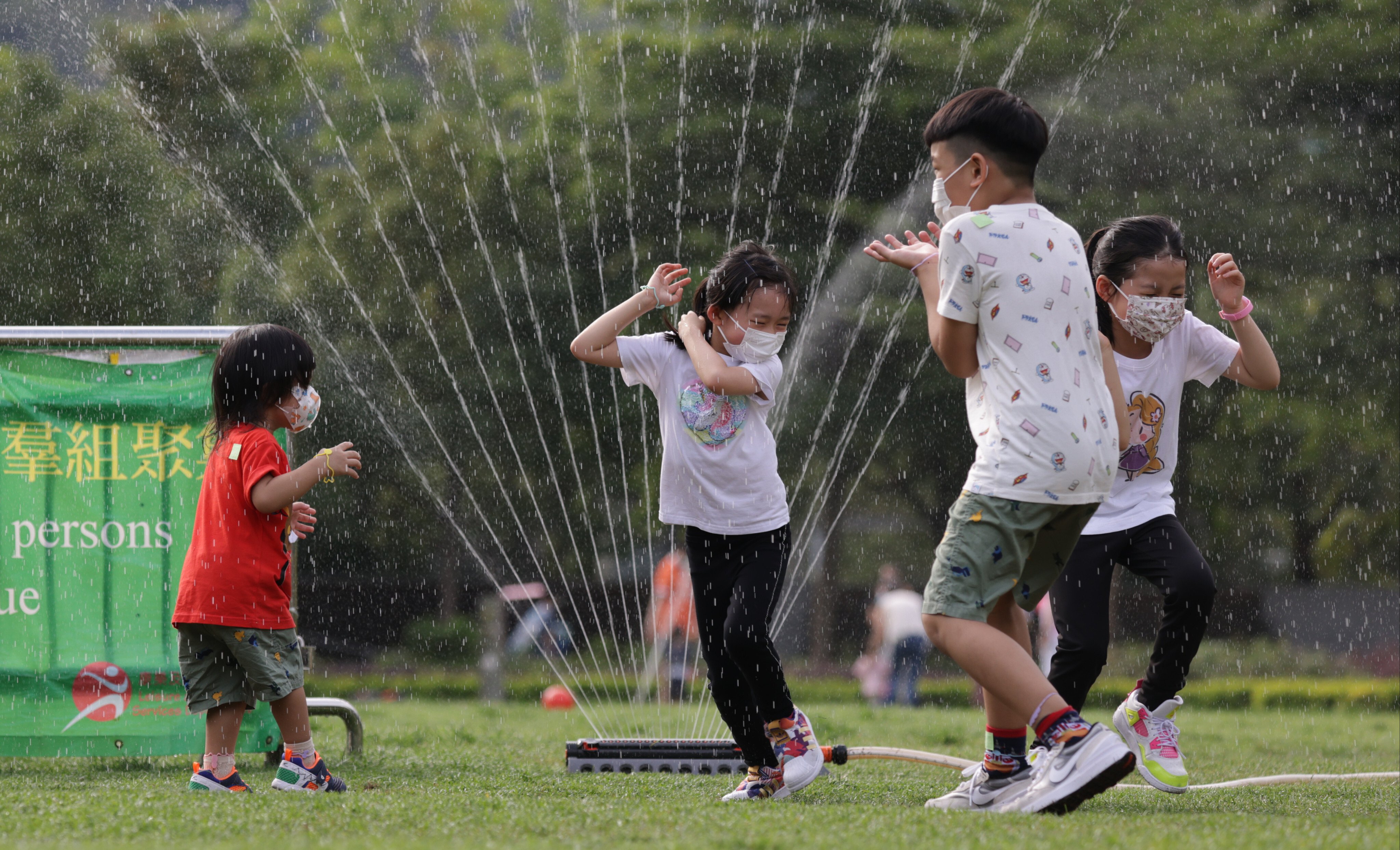 Children playing in Hong Kong’s Velodrome Park in Tseung Kwan O on May 13. Why is Hong Kong not following Beijing’s moves to reduce student workloads and crack down on private tutoring? Photo: May Tse