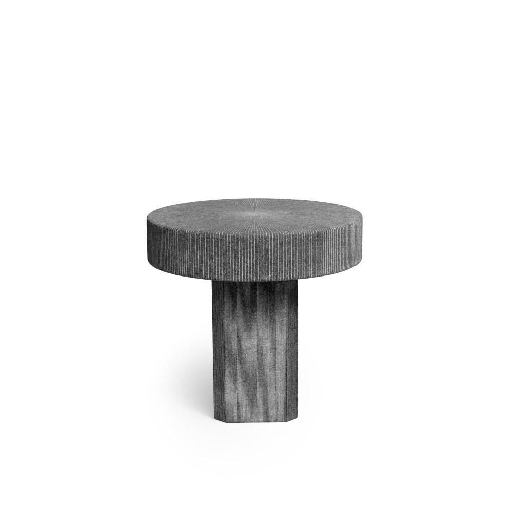 The Lignage d’Hermes stone table begins life black but turns white when engraved. Photo: Hermès