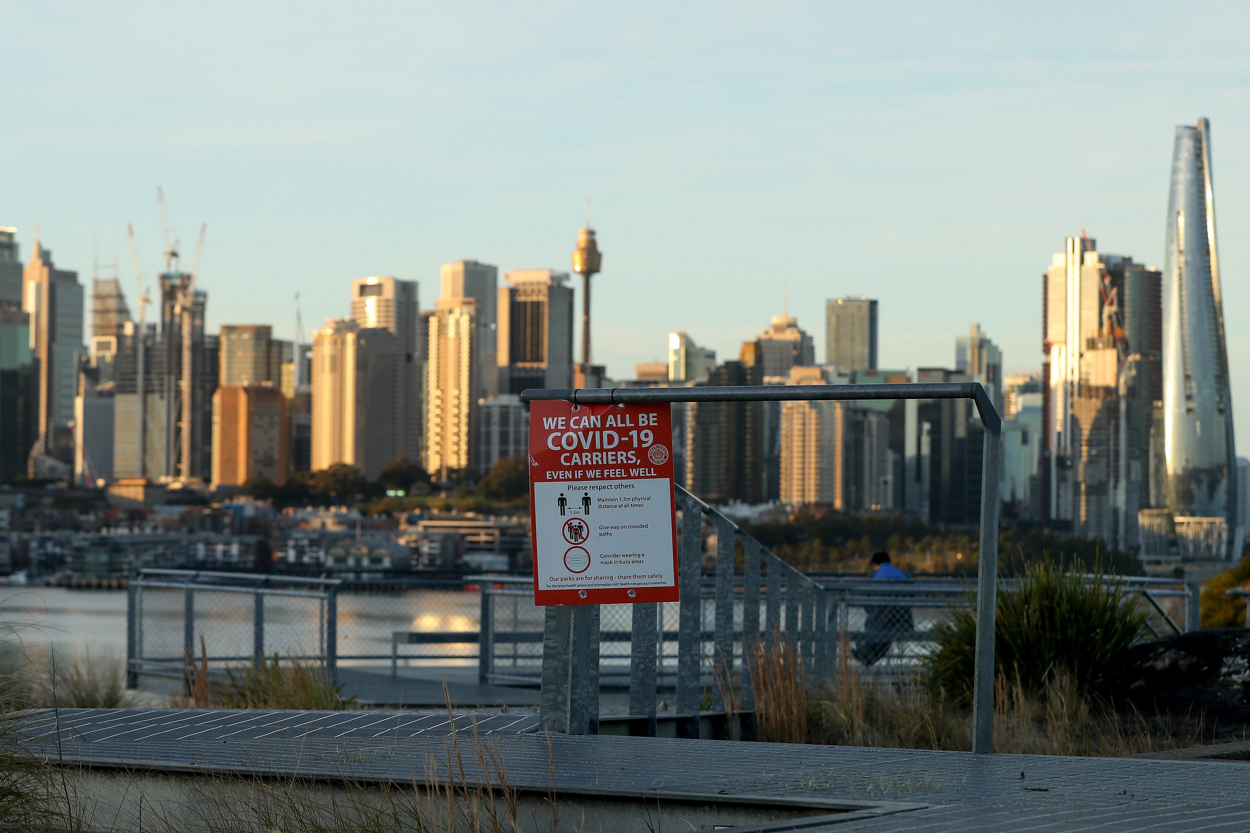 A notice warns people of the dangers of Covid-19 in Sydney, on July 26, 2021. Unlike Hong Kong and mainland China, Australia is easing its “zero-Covid” policy and reopening its borders from next month. Photo: Bloomberg 
