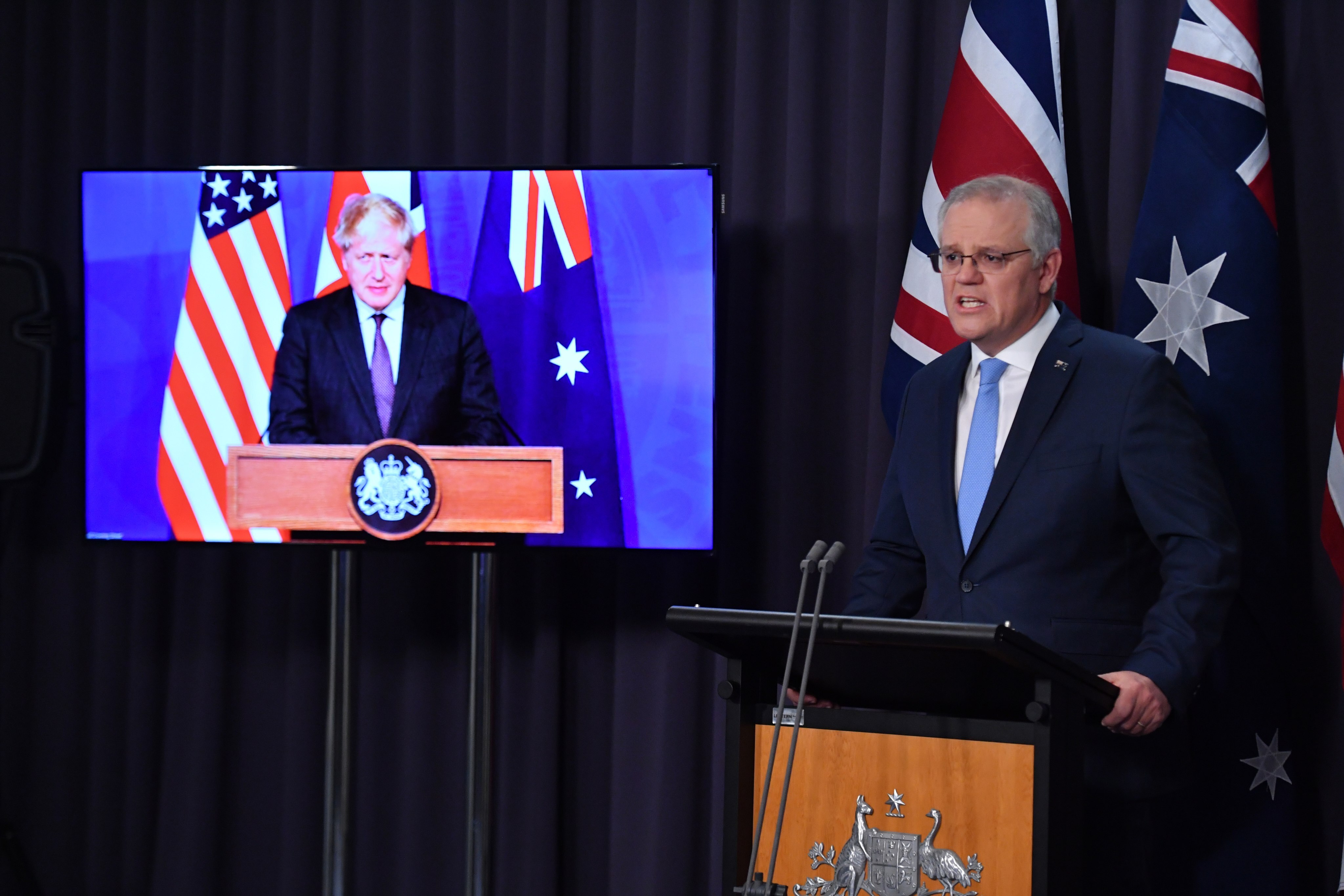 Australian Prime Minister Scott Morrison (right) attends a joint press conference on the Aukus security partnership via video link with British Prime Minister Boris Johnson (left) and US President Joe Biden, from Parliament House in Canberra on September 16. Photo: EPA-EFE 