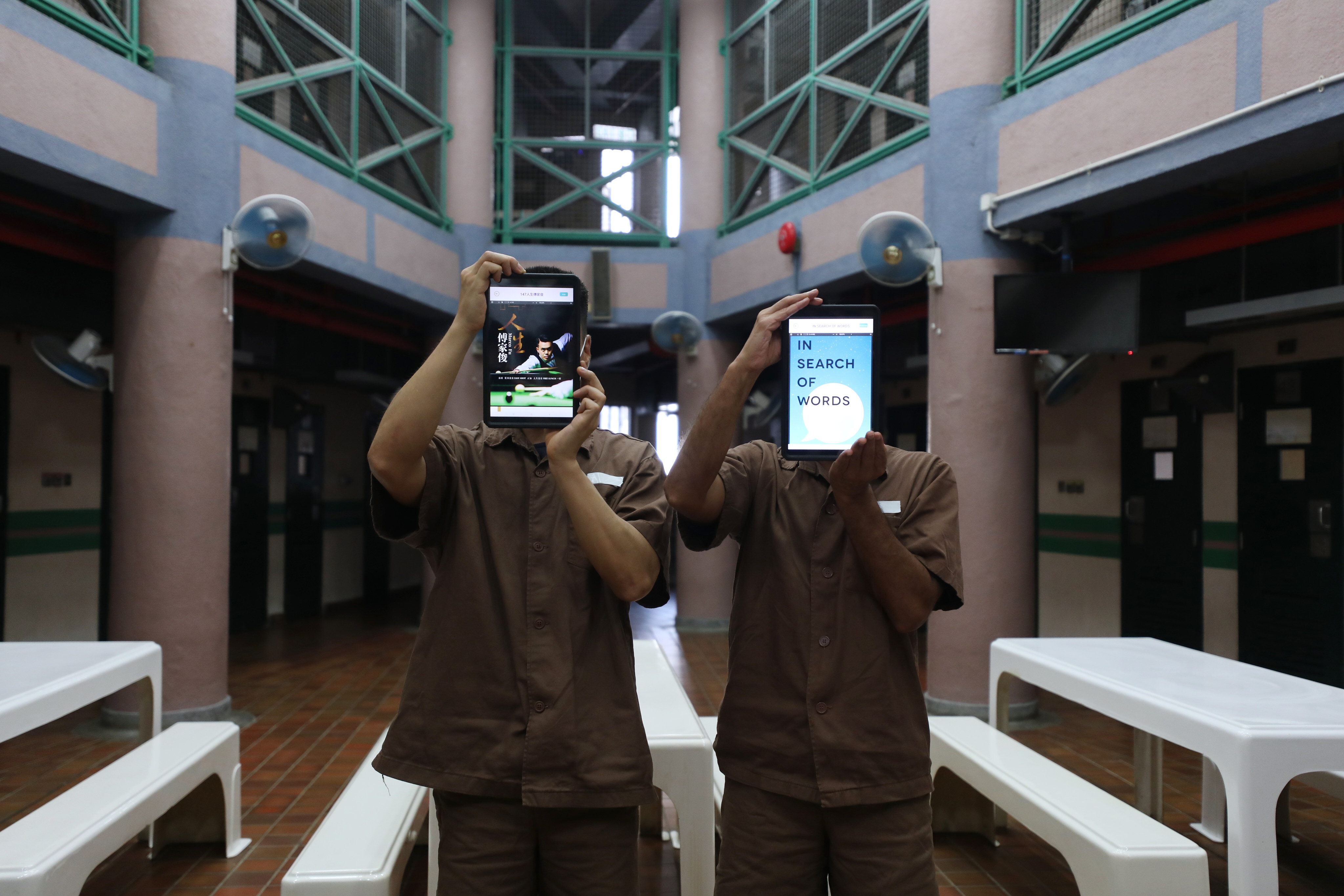 Inmates show off their iPads at Stanley Prison on June 5, 2020. The “smart prison” project allows inmates to learn skills they will need to succeed when they eventually return to the outside world. Photo: Xiaomei Chen
