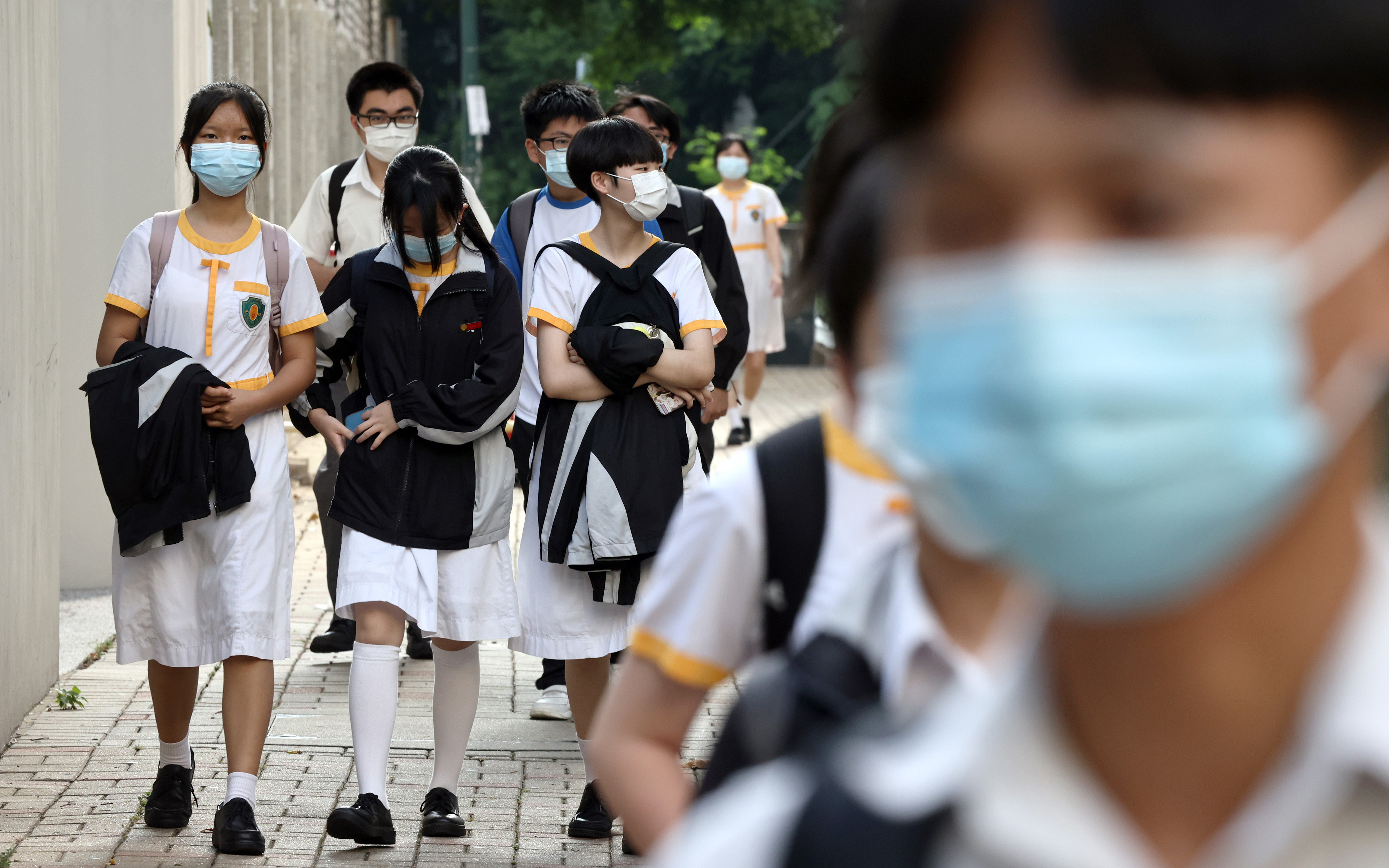 Students head to school in Tuen Mun, Hong Kong, on September 27. Students should feel safe to share their thoughts and feelings. Photo: K. Y. Cheng