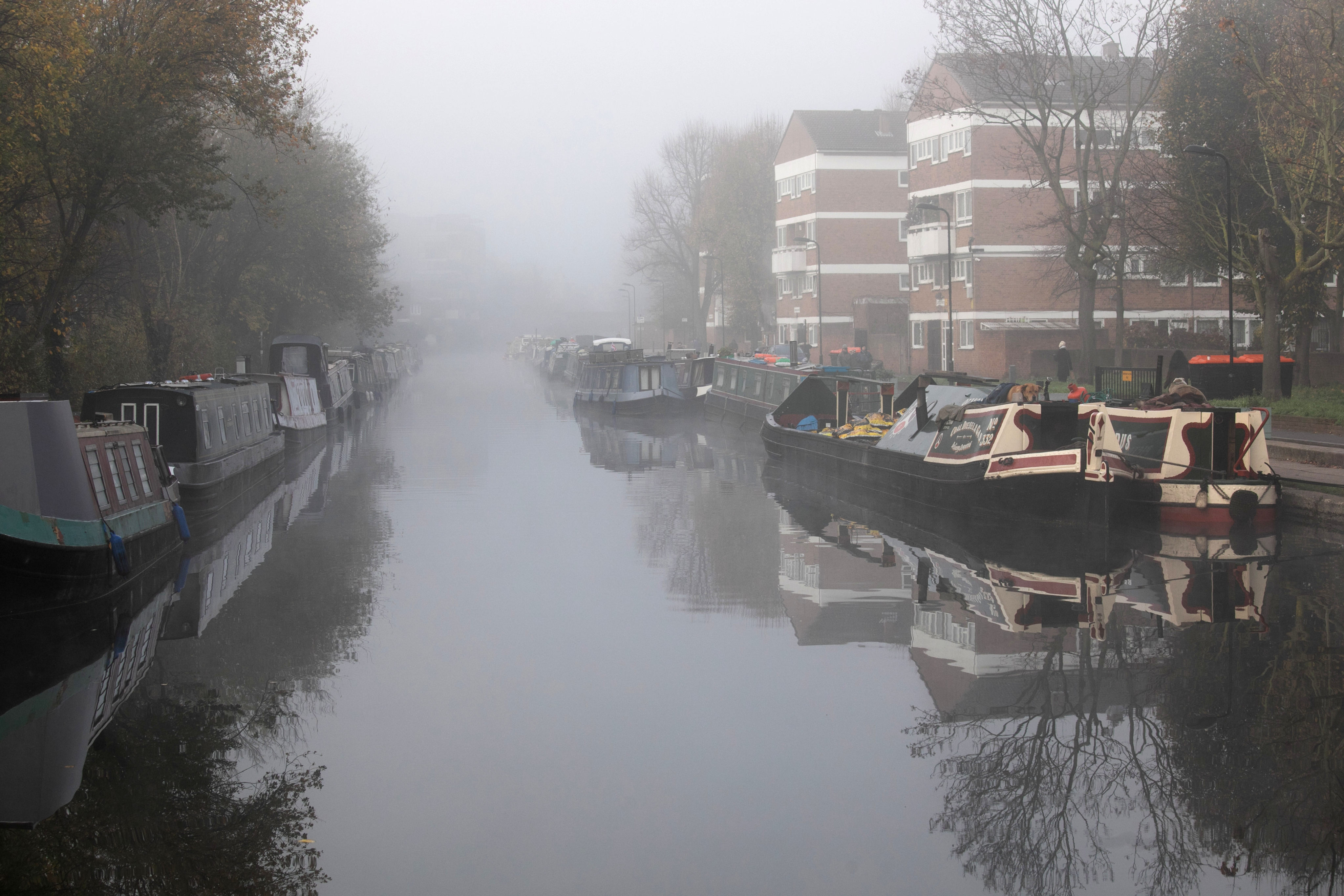 Houseboats moored on Regents Canal, London, the setting for Paula Hawkins’ third novel, A Slow Fire Burning. Photo: Getty Images