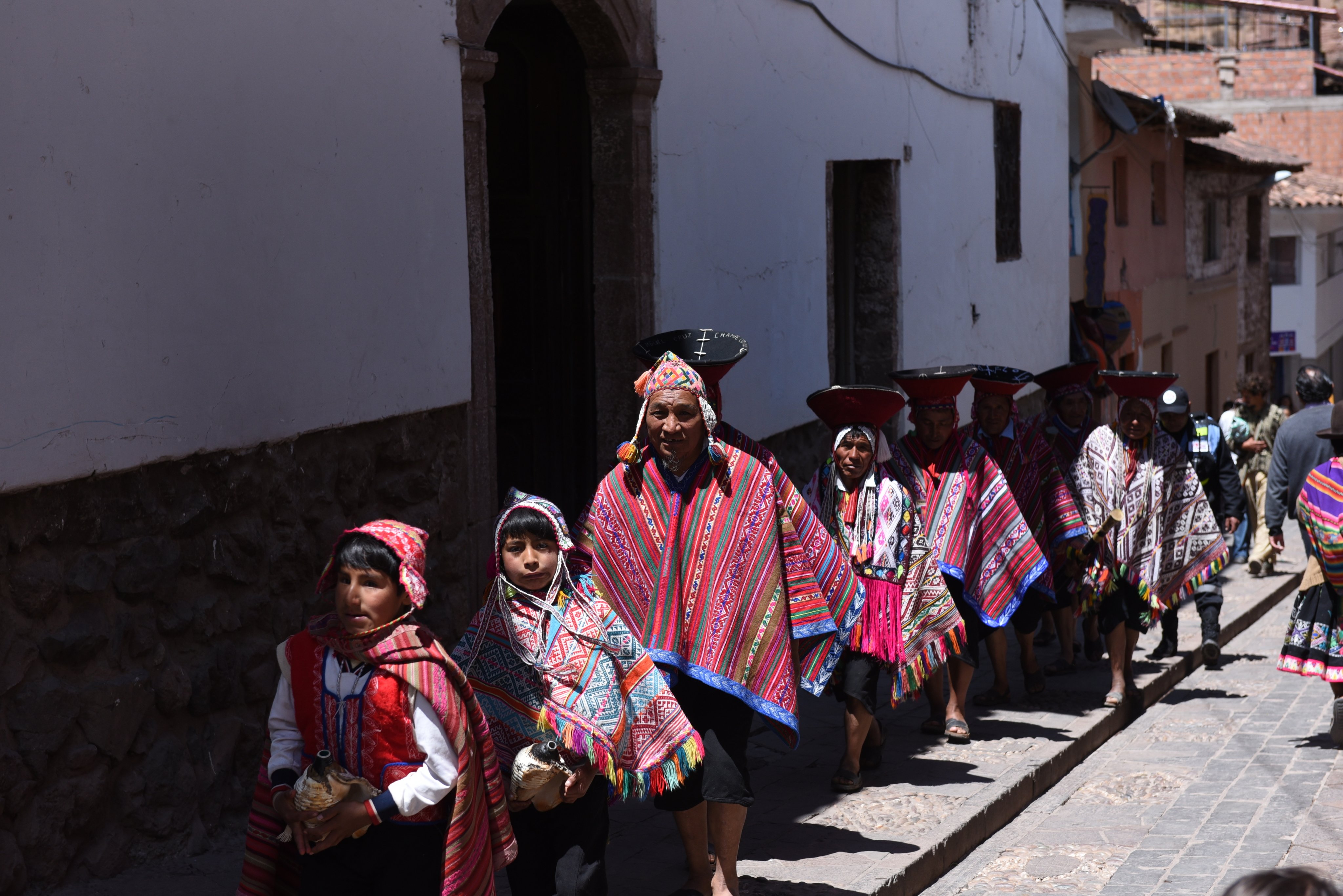 Wedding guests in traditional 
dress head to a church in 
Peru’s Sacred Valley of the Incas, where the ancient language of Quechua is spoken. It is one of the languages listed as in danger by Unesco that is undergoing a revival. Photo: Getty Images